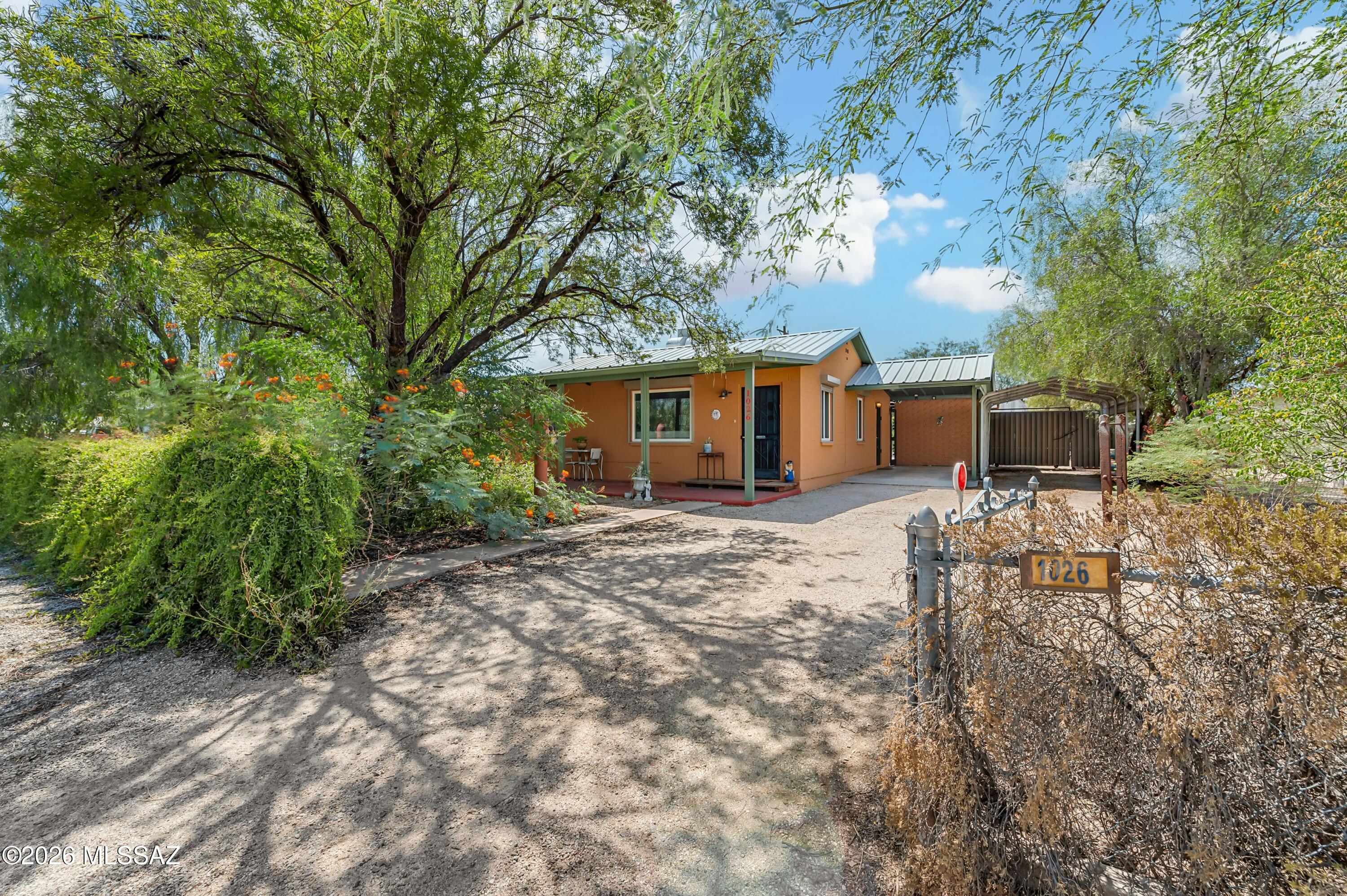 Seller will accept/counter offers btwn $325K-$335K. Charming 3BR/2BA, 1,193 sq. ft. Tucson home with much more than meets the eye! This unique property offers a private setting, mature landscaping and exceptional indoor/outdoor versatility. Features include dual-pane windows, security rolling shutters and an insulated attic. Enjoy a 30' covered front porch, covered rear patio, multiple covered outdoor areas and a 20' x 12' ramada. The standout 17' x 27' Quonset hut offers incredible flex space for a workshop, studio, hobbies or storage. Additional storage, covered parking and a rainwater harvesting cistern add functionality. Centrally located and full of character, this distinctive property offers privacy, outdoor living and possibilities rarely found at this price point.