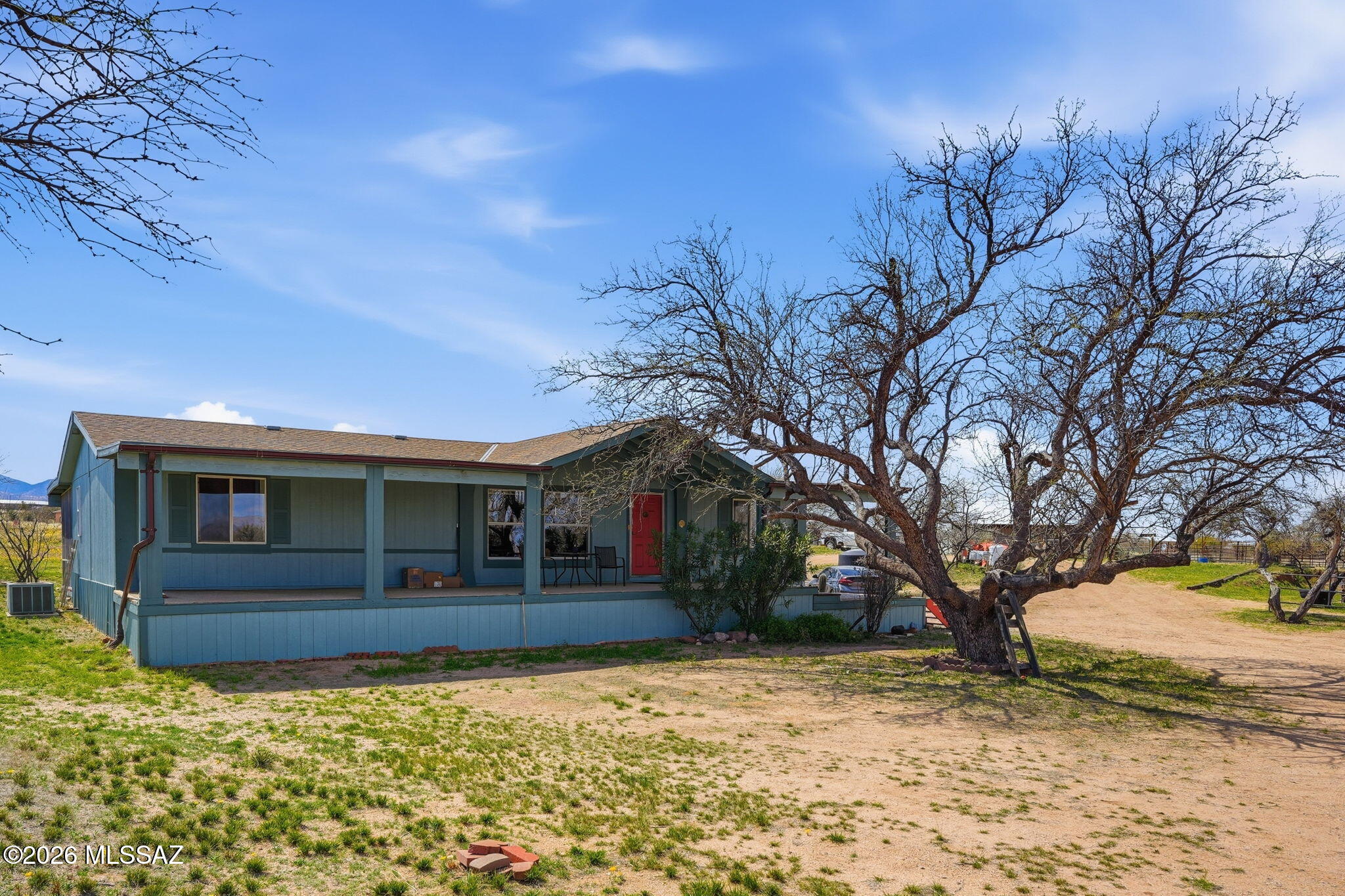 Horse Lovers, Welcome Home!  Three bedroom, Two Bath with recently upgraded kitchen that includes Pergo flooring, new appliances and cabinets w/soft close drawers and slide out shelves.  Front porch with new outdoor carpet flooring, faces west, perfect for enjoying FABULOUS mountain views.
New Dual Pane windows in large Arizona Room that offers SPECTACULAR VIEWS of 2 mountain ranges.   Horse facilities include a barn w/4 attached stalls, PLUS a pole barn 15' x 36', 10' high on separately fenced 4.78 acres.  On 9.38 total acres.