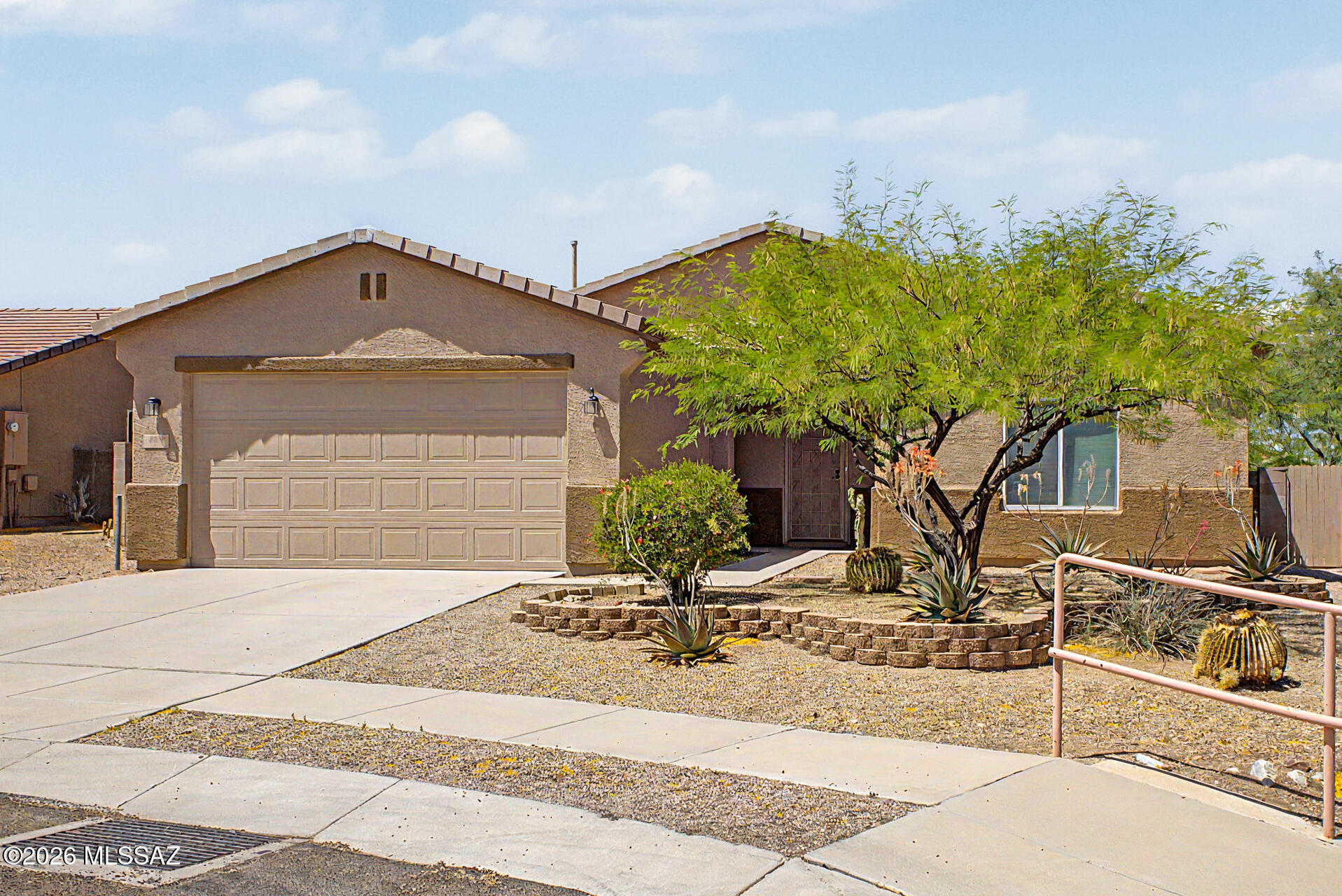 Outstanding contemporary home in the desirable Santa Rita Ranch neighborhood! This spacious gem offers over 2,000 square feet of living space with 4 bedrooms and 2 bathrooms, designed for comfort and style. The interior features two-tone custom cabinetry and designer paint, complemented by sleek stainless steel appliances. Plush carpet adds warmth to the guest bedrooms, while the primary suite stands out with tile flooring, a massive walk-in closet, and a beautifully updated bathroom featuring a new vanity, countertop, and stylish tile shower surrounds. Step outside to a professionally landscaped backyard complete with artificial turf, pavers, and a covered patio--perfect for relaxing or entertaining. A must-see!