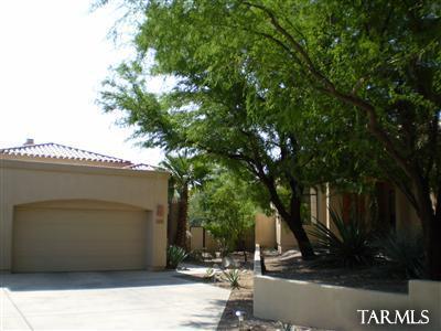 Enjoy resort-style living in this beautiful home nestled on a private cul-de-sac in the sought-after Starr Pass community. Take in stunning golf course and mountain views from the fully covered patio and walled backyard, offering both privacy and scenic beauty. Inside, you'll find a spacious floor plan featuring a formal living room and dining room, plus a comfortable family room with a cozy gas fireplace. Skylights provide abundant natural light throughout the home. Tile flooring enhances the living room, main traffic areas, and bathrooms, while the bedrooms feature comfortable carpeting.  The generous primary suite includes a garden tub, separate shower, and a large walk-in closet. A three-car garage provides ample space for vehicles and storage.   Equal Housing Opportunity