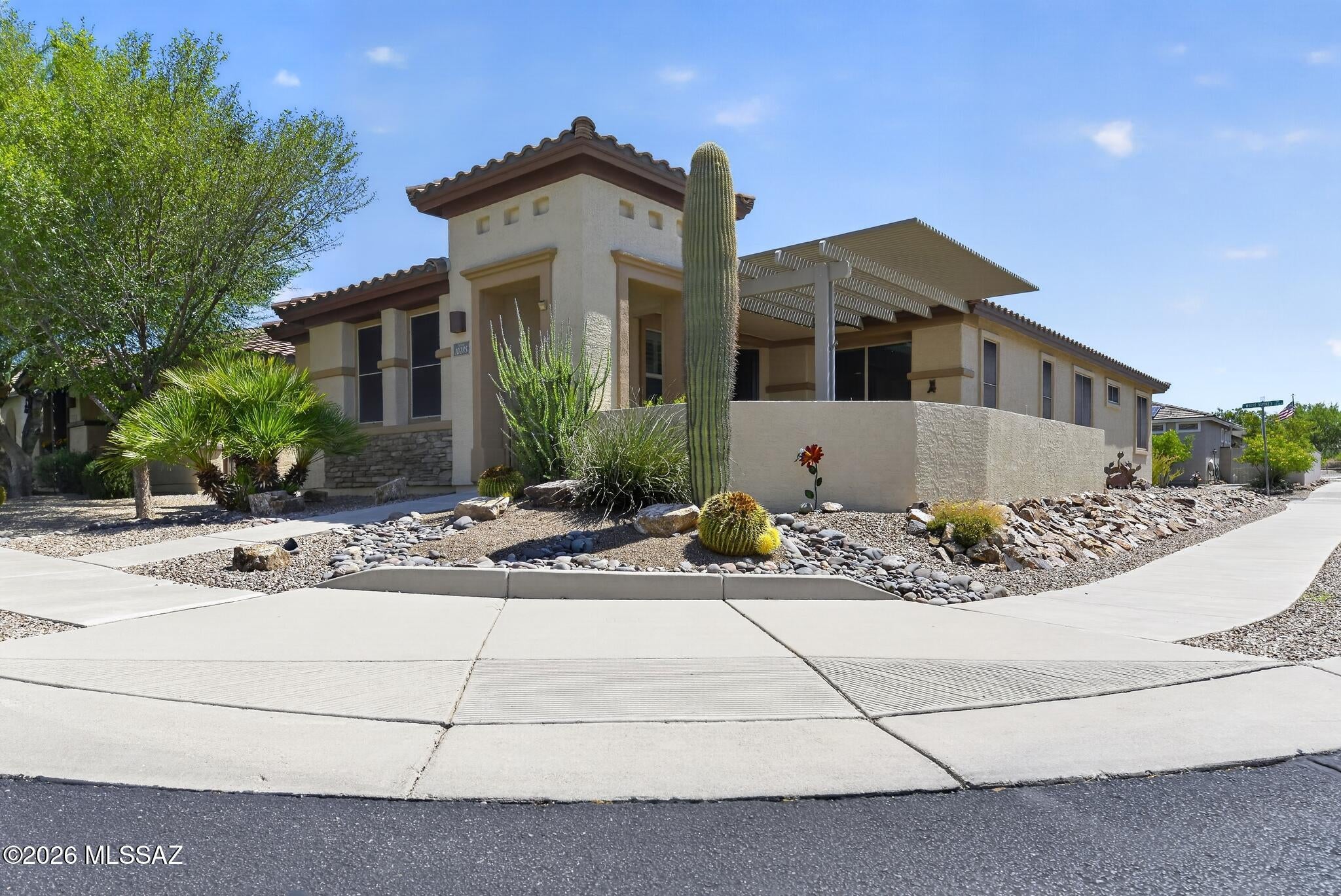 Wonderful 2BR+Den 2BA home on a corner lot in 55+ community of Del Webb at Rancho del Lago. This is a great price for a move in ready home w/newer HVAC system (2021). Tile everywhere except BR's. Solar system is owned which helps keep electric bills manageable. Kitchen is spacious w/quartz countertops, large breakfast bar & tiled backsplash. Plantation shutters keep home cooler in the summertime. Primary BR w/nice size walk in closet. Front courtyard patio w/Ramada & nice sunsets. This is truly a must see well cared for place to call home !!
