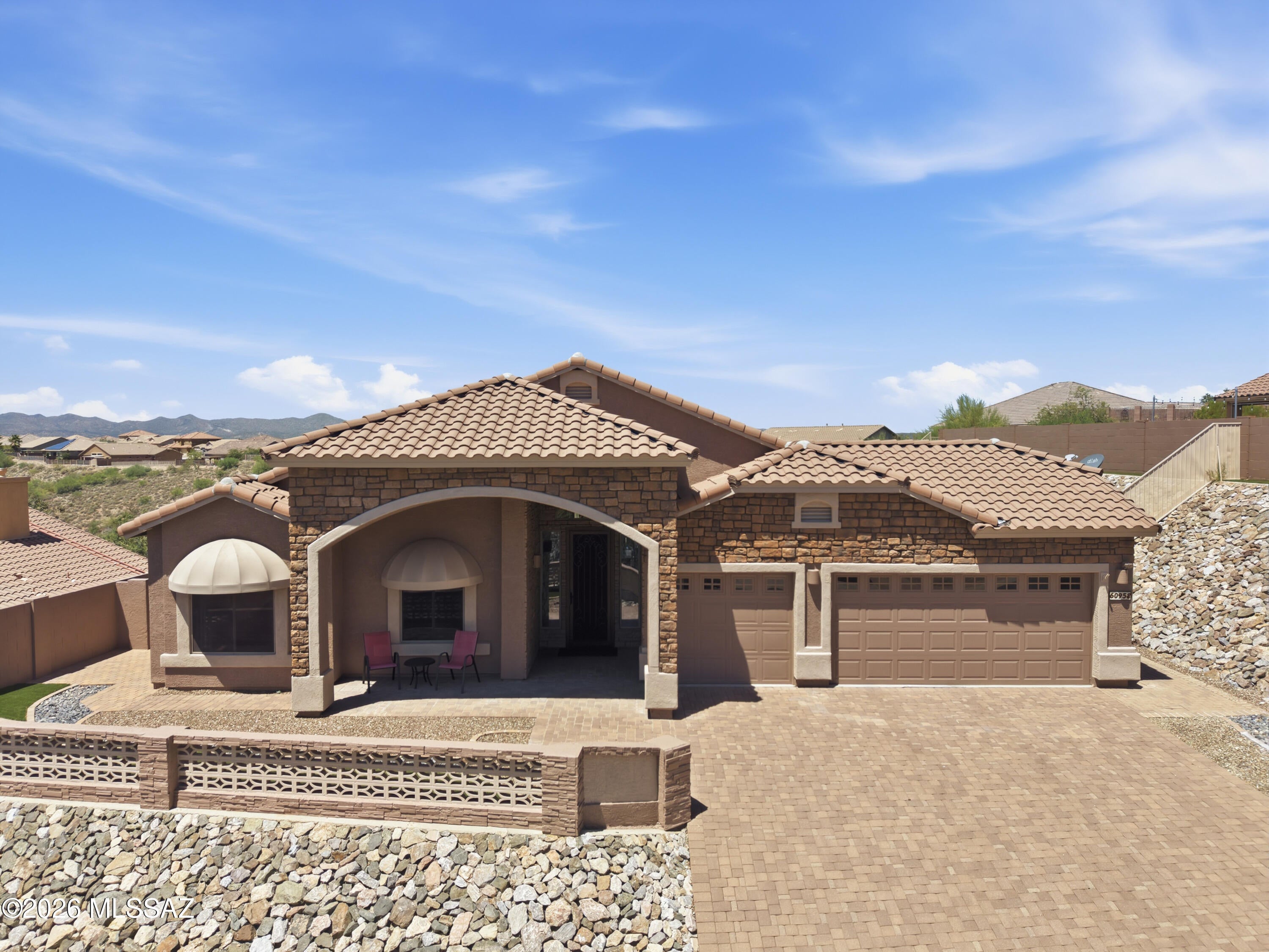 Amazing opportunity to own a home in the highly sought-after Eagle Crest Ranch. Perched at the top of a ridge, this property offers incredible privacy, Catalina Mountain views from the front, expansive desert views from the beautifully landscaped backyard, and no rear neighbors. Homes at this elevation rarely become available, making this a truly special opportunity to own in one of the community's most desirable locations. Inside, the home has been impeccably maintained and thoughtfully updated with new LVP flooring, an additional mini split in the primary bedroom, new ceiling fans and light fixtures, newer exterior paint, and a new guest bathroom vanity. Beautifully maintained inside and out!