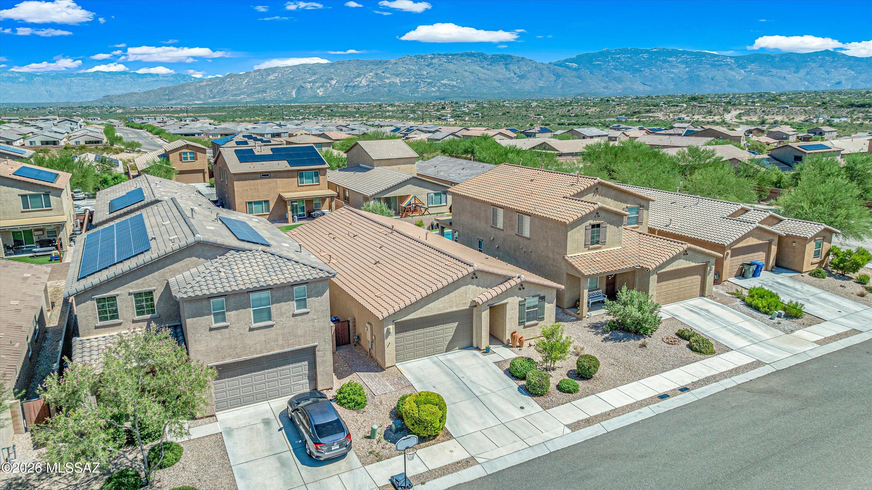 MOTIVATED SELLERS. Call For Interest Rate Incentives. Nestled in the gated community of The Vistas at Rincon Knolls, this inviting single-family home offers the perfect blend of modern comfort and Arizona desert living. The open-concept design connects the kitchen, dining, and living spaces for everyday ease and effortless entertaining. The primary suite provides a private haven, while secondary bedrooms offer flexibility for kids, guests, or a home office. Relax and enjoy your low-care backyard retreat, perfect for evening BBQs, stargazing under the Sonoran sky or quiet mornings with coffee and sunrises. Daily views of the surrounding desert landscape and distant Rincon Mountains. Active, nature-connected lifestyle with hiking, biking, Saguaro National Park close by. Gated & award-winning schools