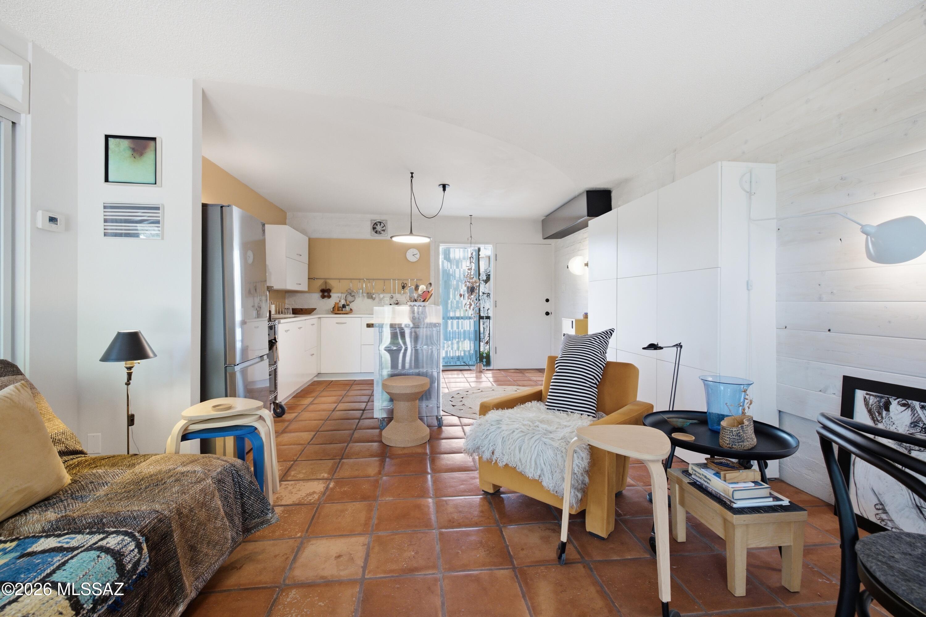A distinctive one-bedroom opportunity in the heart of Oro Valley, where thoughtful design, beautiful surroundings and effortless Arizona living come together. This first-floor home is filled with warmth and character, from its light-filled living spaces and exceptionally well-planned kitchen to a spacious bedroom and charming rear garden patio. Thoughtful improvements maximize both comfort and function throughout. Just beyond the home, enjoy the community pool and gathering areas framed by the Catalina Mountains. Beautifully cared for and refreshingly individual, this is a special place to call home.