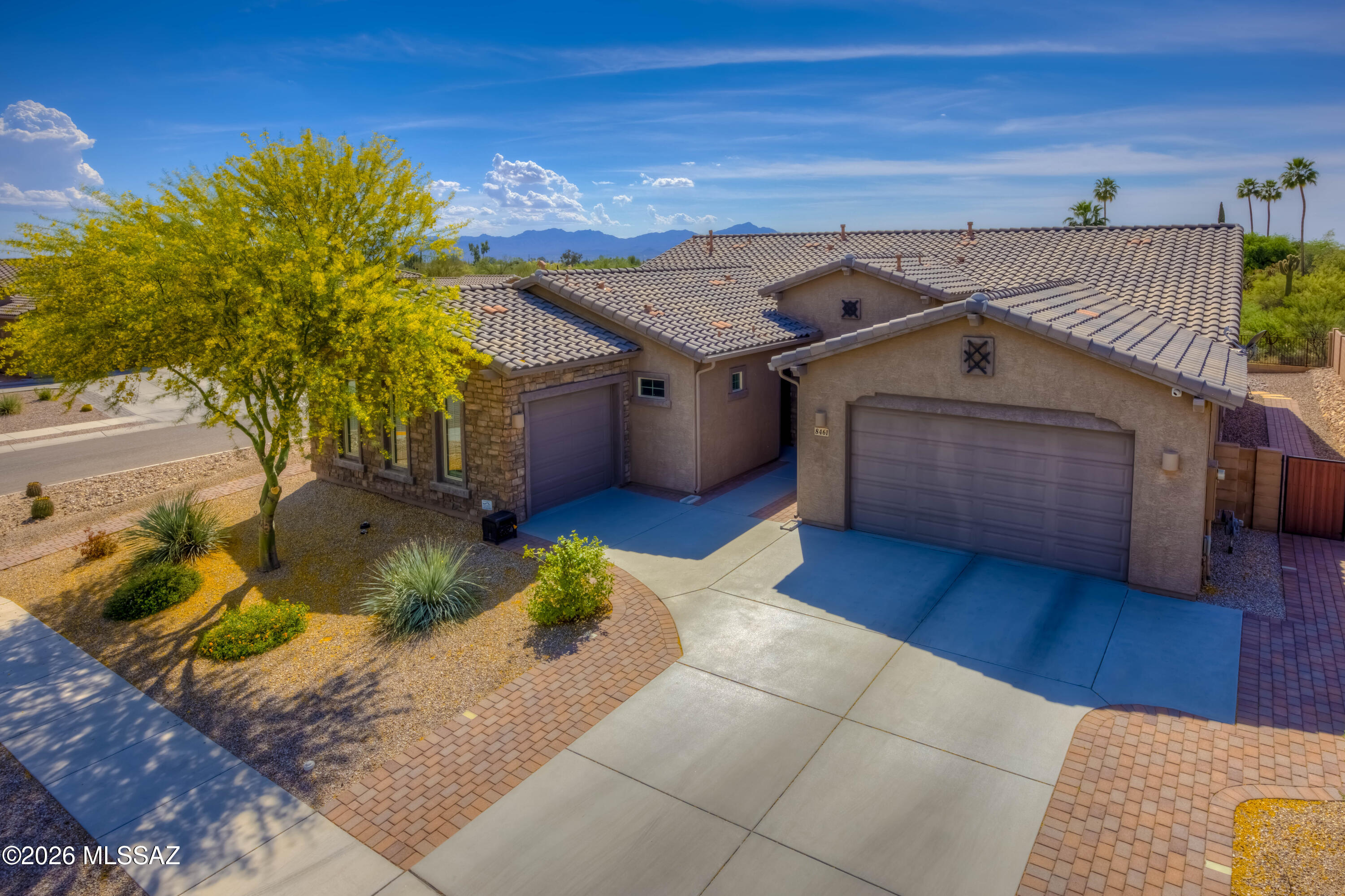 A new build can't compete with this stunning NextGen home in exclusive Overton Reserve! Meticulously maintained and improved by a single owner, this home is perfectly situated on a corner lot with natural desert common area behind. A beautiful mature Palo Verde tree welcomes you to the front door with matching decorative wrought-iron security doors to the main home and the NextGen suite. Sweeping views to the west are visible through the great room, framed by a wall of windows and high ceilings. An open kitchen looks into the great room and dining room, with granite counters and a large island. The NextGen suite includes a full kitchen, living room, bedroom, bathroom and laundry area. This gorgeous home has too many features to describe - see the features list and come see it today!