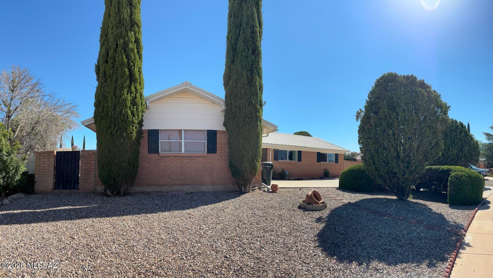 Welcome to this well-maintained 3-bedroom, 2-bath home offering 2,084 sq. ft. in the highly sought-after Kings Manor subdivision of Sierra Vista. Conveniently located near shopping, dining, and the local hospital, this home features a decorative wrought iron security entry and numerous upgrades throughout. Enjoy updated quartz countertops (2017), modern appliances (2018), beautiful flooring (2019), reverse osmosis system, tankless water heater, and a washer and dryer installed in 2022. Combining comfort, style, and convenience, this move-in-ready home is an outstanding opportunity in one of Sierra Vista's most desirable neighborhoods. Schedule your showing today!