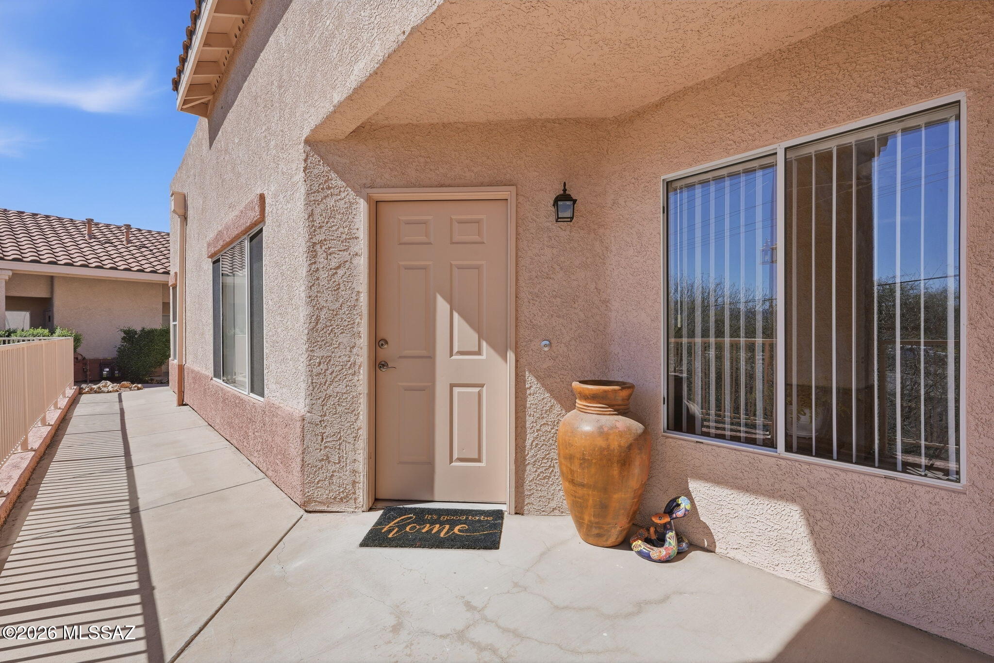Home sweet home!   No age restrictions!
Beautifully remodeled and move-in ready!  Prime location minutes to shopping and I-19.   An Arizona Room  extends your living space.  The thoughtfully designed kitchen offers smooth countertops and ample workspace, opening to a cozy dining area.
Two primary suites include spacious dressing areas, organized closets and updated baths.

Enjoy the welcoming front porch and comfortable outdoor living. This charming home offers an inviting living room with clean lines and a flowing floor plan, perfect for intimate gatherings and is highlighted by a large picture window that brings in abundant natural light. The living space flows seamlessly to the kitchen, meticulously maintained with smooth countertops, good counter space, and ample workspace for meal prep.  A cozy dining area opens to a spacious Arizona Room, ideal for relaxing or entertaining.

The primary bedroom is a warm, inviting retreat featuring a large dressing area, an organized closet, and an en suite bath with an easy-access shower, smooth countertops, ample counter space, and a convenient washer/dryer closet.  The second primary bedroom offers privacy and comfort, complete with a walk-in closet and an en suite bathroom with tub/shower combination and newer fixtures.

Additional highlights include a welcoming front porch, perfect for enjoying the outdoors, and a well-designed layout that emphasizes flow, function, and comfort throughout the home.