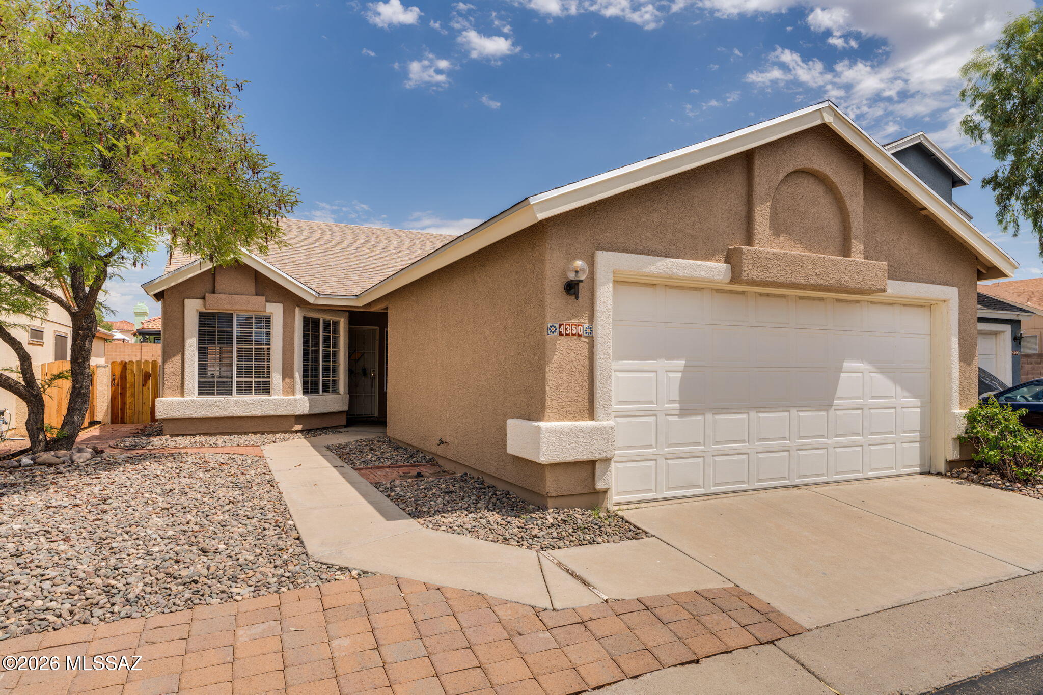 Every inch of this beautifully renovated 3-bedroom, 2-bathroom home has been thoughtfully redesigned with today's buyer in mind. Combining timeless style with quality craftsmanship, this move-in-ready Northwest Tucson home showcases modern finishes, extensive upgrades, and meticulous attention to detail throughout.

The remodeled interior features new quartz countertops, beautiful laminate flooring throughout the main living areas, new carpet in the bedrooms, and designer tile surrounds in both bathroom showers that add a unique, contemporary touch. Fresh interior and exterior paint, new ceiling fans, and new window blinds complete the home's fresh, updated feel. Beyond the cosmetic upgrades, this home offers valuable improvements, including a new shingle roof and the replacement of all polybutylene plumbing with durable PEX piping, providing added peace of mind for years to come.

The spacious 2-car garage offers plenty of storage, while the community amenities include a sparkling pool and relaxing spa for residents to enjoy. With its thoughtful renovations, quality upgrades, and convenient Northwest Tucson location, this home is truly turnkey and ready for its next owner.