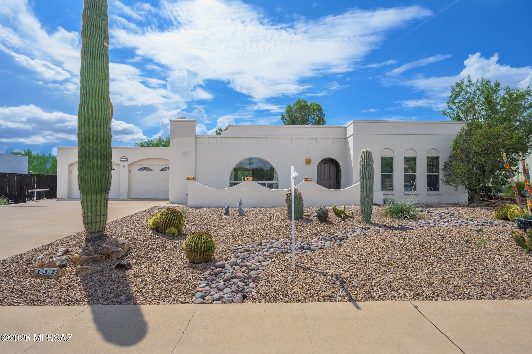 Bright, inviting, and set in the highly desired Green Valley Country Club Estates! This charming home features a spacious kitchen, updated electrical and plumbing in the kitchen and baths, and a comfortable year-round Arizona room. The primary bedroom offers an ensuite bath, while the flexible second bedroom includes a Murphy bed and desk. The backyard shines with a plumbed gas firepit and built-in BBQ, beautifully paved with shade tree and backs up to a great walking trail. Garage and workshop are a true bonus with mini-splits and plenty of driveway parking. New roof in 2025!