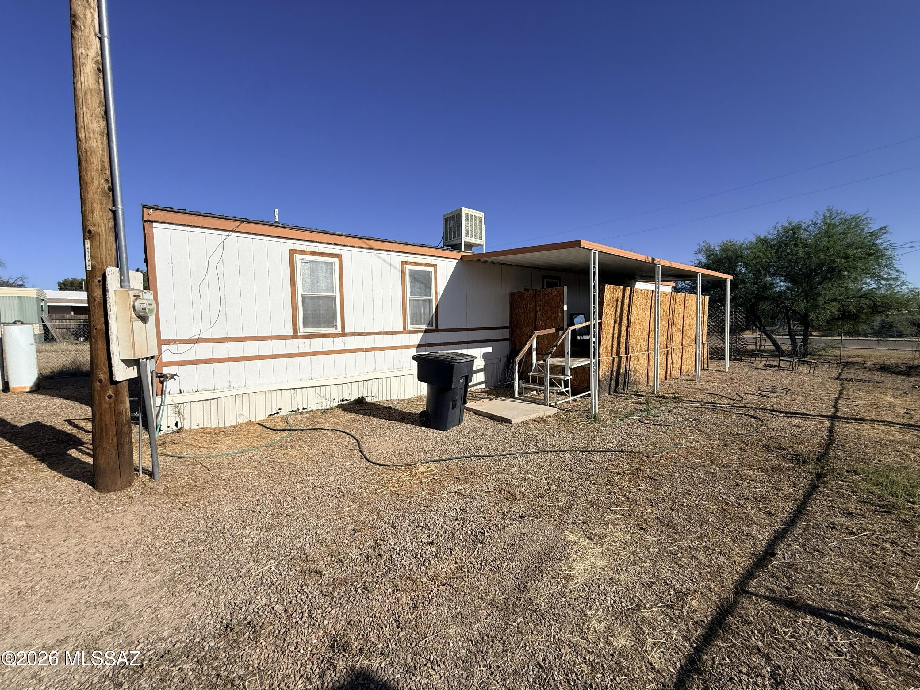 Motivated seller will consider all reasonable offers. Affordable Benson living with plenty of potential! This mobile home features a split bedroom floor plan, open kitchen, dual pane windows and comfortable living areas. Enjoy a fenced double lot with room for RV parking, outdoor entertaining, gardening, or additional storage. Two storage sheds add extra convenience, all located close to schools, shopping, and easy access to I-10. Home is being sold as-is.