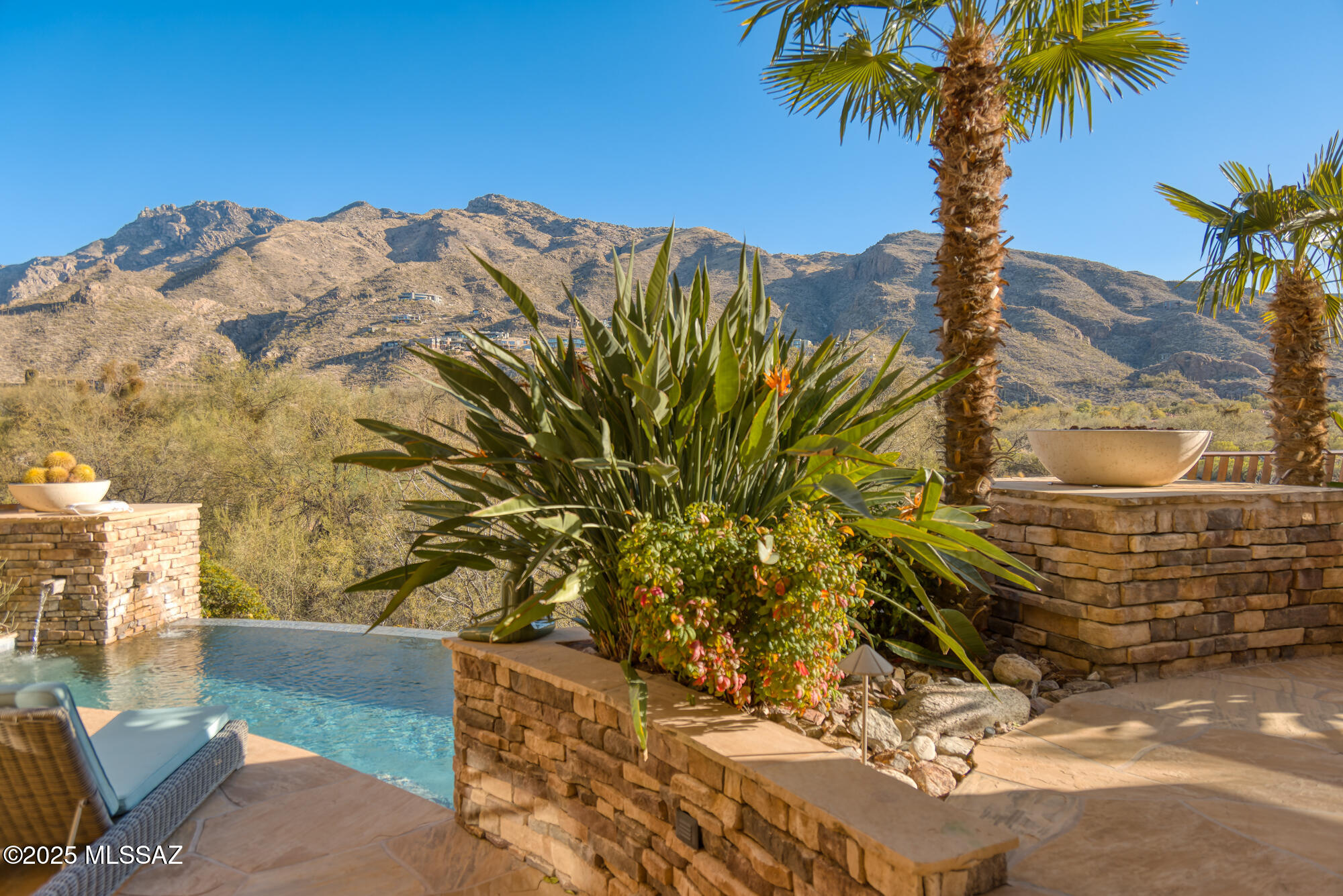 One of Ventana Canyon's Finest Homes Located at The End of Its Most Prestigious Street, Whaleback Place, Offering Commanding Mountain, Golf Course, & Valley Views. Elegant Style & Finishes Throughout This 5535 SqFt  4 BR & 6 BA Custom Home. Fine Features Include: Courtyard Entry - Living Room w/Vaulted Wood Beam Ceilings, Stone Fireplace & Floor to Ceiling Windows w/Spectacular Views - Spacious Island Kitchen w/Stainless Appliances & Breakfast Area - Office w/Wood Panel Ceiling and Fireplace - Media Room - Primary Suite w/Fireplace & Private Balcony w/Sweeping Views, Spa Like Bath w/Fireplace, Soaking Tub, Walk In Shower & Custom Closet - Two Temp Controlled Wine Rooms - 3 En-Suites, Luxurious Outdoor Living Spaces w/Kitchen, Bath, Fireplace, & Pool + Hot Tub, & Unbeatable Panoramic Views