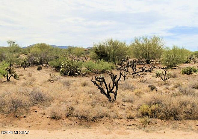 4.5 ACRES! Developed in the 1960's Diamond Bell Ranch Unit 2 is a vintage rural neighborhood. AND this lot is one of the rare ones with ACREAGE! ONLY 1/2 MILE TO A PAVED ROAD! Space to spread out. Freedom to built the type of home you need and desire. No HOA to cramp your style. Next door is a desert-friendly rammed earth, solar casita. Solar is a great option. Electric poles on next street north but not super close. Drill a well or haul water. Zoned Suburban Ranch - site built homes required BUT, temporary mobile/RV allowed with permit. Live under the stars and at peace with the desert. Vast state land holdings border Unit 2 for hunting/hiking/recreational opportunities!