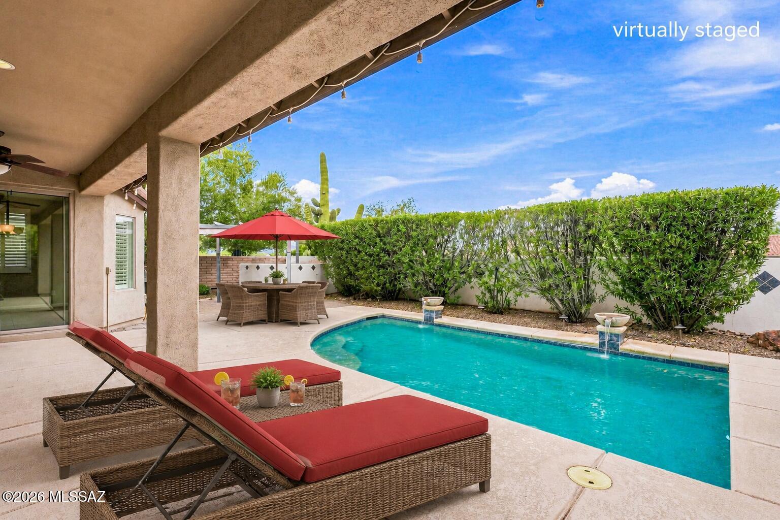 Embrace resort-style living in this beautiful 2-bed, 2-bathroom home, plus a den, located in an active retirement community, where everyday feels like a vacation. The spacious main suite features a private ensuite and spacious walk-in closet, while the split floor plan gives guests added privacy. The open great room offers a cozy fireplace and inviting entry. The kitchen features granite countertops, ample cabinets, a large pantry, included appliances, and a convenient dining bar. Step outside to your covered patio and private heated sparkling pool; perfect for relaxing, enjoying the Arizona sunshine, or entertaining with a backyard, included BBQ. The low-maintenance landscaping creates a peaceful outdoor setting. Additional features include a spacious 2 car garage, with epoxy flooring. Inside the guard-gated community, enjoy resort-style amenities including pools, spas, golf, tennis, pickleball, racquetball, a restaurant, a tech center, and the new Canyon Club: A resort-style hub, right in your community!
Come make this your Arizona retreat!