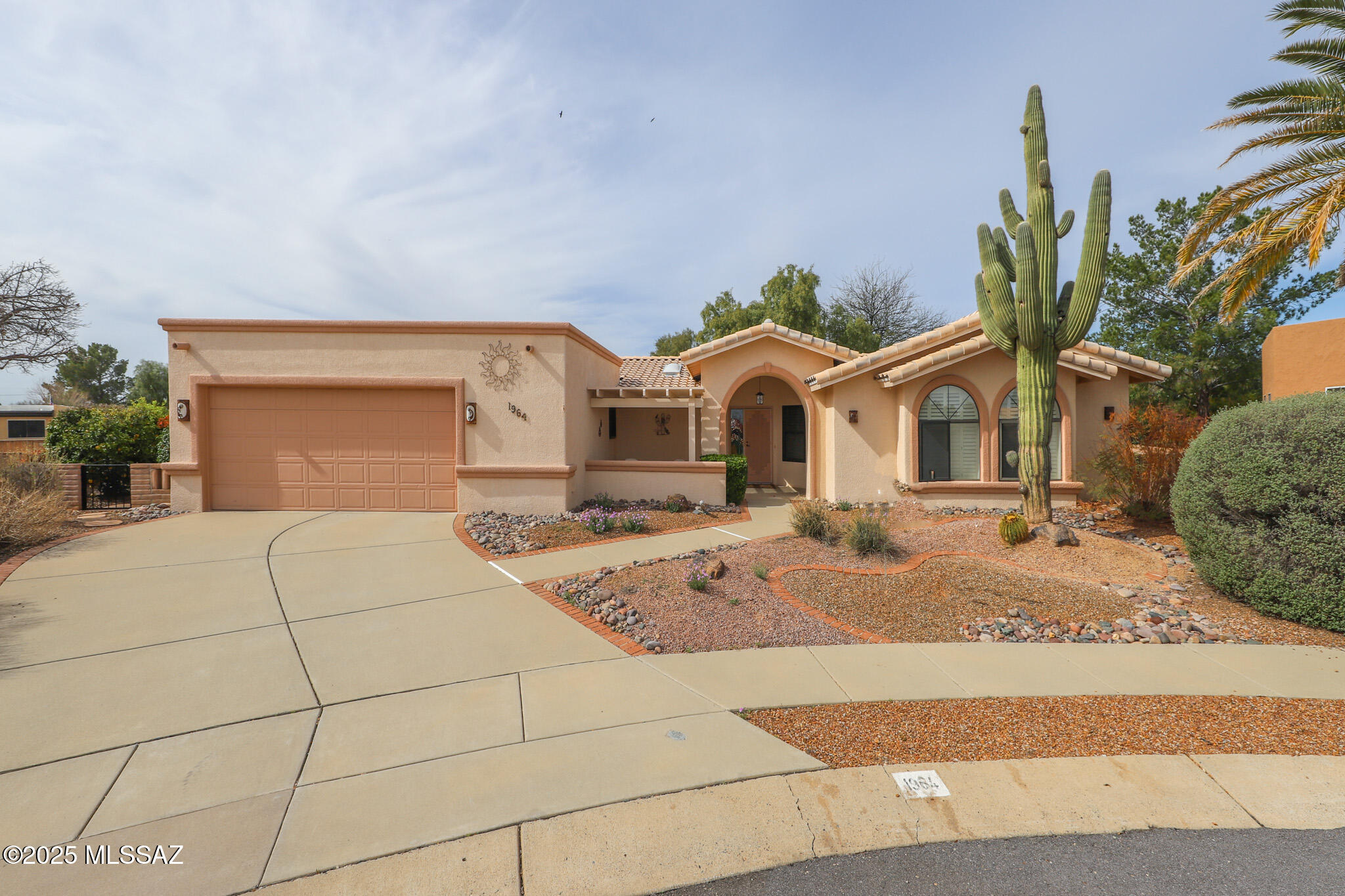 Refined Desert Living with GVR Lifetime Membership - Private Cul-de-Sac Retreat

Exceptional custom 2-bedroom, 2-bath residence (1994) set on a quiet cul-de-sac, offering privacy, comfort, and a refined desert lifestyle. Thoughtfully designed with a 2-car garage, dedicated den and office, and a seamless flow for both everyday living and entertaining.

The outdoor space is a true retreat, featuring a covered, screened-in patio, mature fruit trees, and a tranquil water fountain, creating a serene, resort-style setting. RV parking adds flexibility for seasonal living and travel.

Interior highlights include an electric fireplace and well-appointed living spaces that reflect comfort and understated sophistication.

Green Valley Recreation (GVR) lifetime membership is included, providin