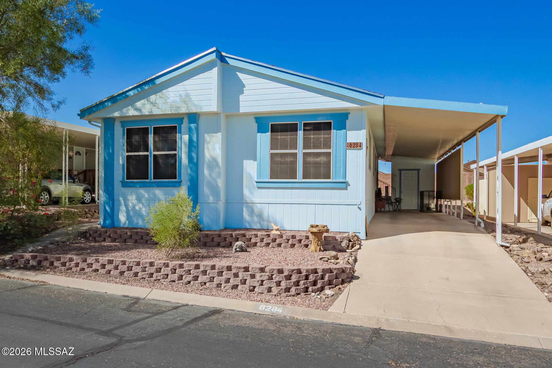 Charming home in 55-plus community which is neatly maintained. Freshly painted inside with several upgrades such as flooring recently replaced in kitchen, bathrooms and dining area. Roof was replaced approximately 4 years ago, as well as stove recently replaced approximately a year and a half ago. Lovely covered patio with privacy screen. Several amenities included with a low HOA fee which includes pool, spa, shuffle board, billiards, large activities/dining area which host events throughout the year. Also included is water, sewer and trash.