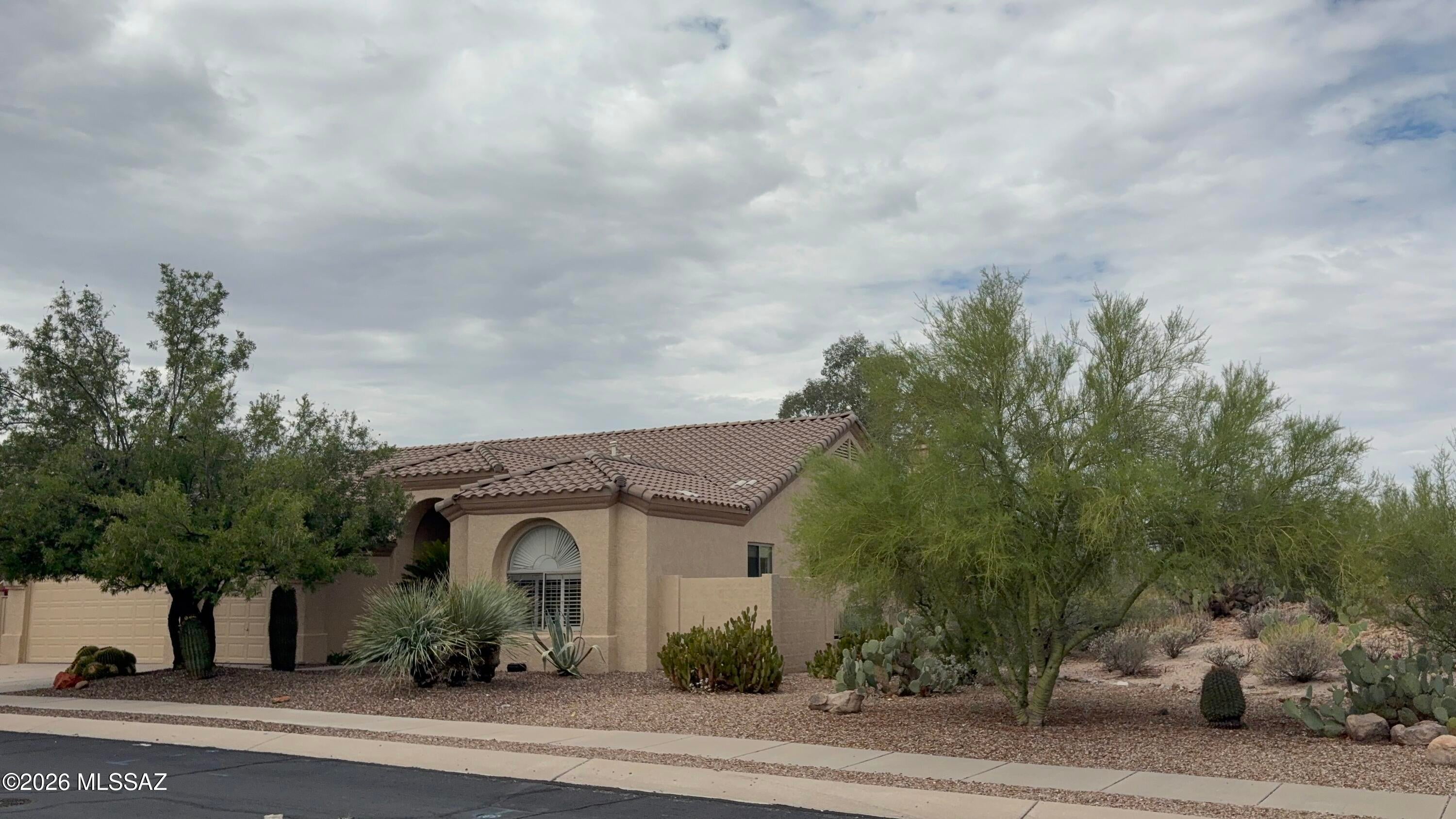 Wonderful 2412 sq ft home in sought after Rancho Vistoso has been newly painted inside and out!  Premium lot with Green Space on 2 sides and a gorgeous backyard providing peaceful living.  Split bedroom plan with three spacious bedrooms plus a separate, flexible den perfect for a remote workspace or media room (easily converted to a 4th Bedroom). Kitchen has plenty of cabinets including a recessed pantry.  Three car garage with ample space.  Move right in!