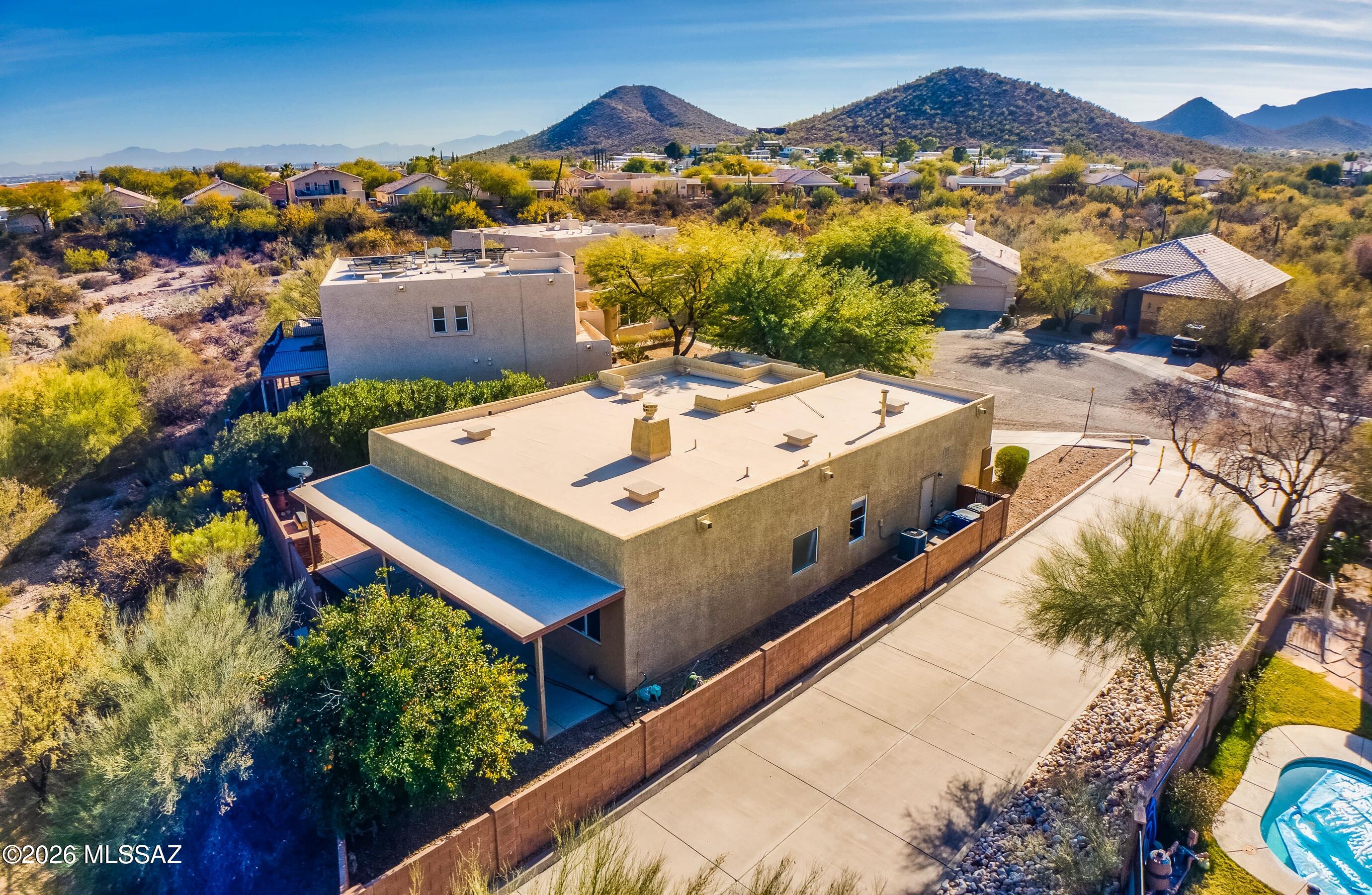 This home is range priced: $435,000-$450,000. Stunning remodeled home on a private cul-de-sac with unobstructed Catalina Mountain views -- and an HOA of just $240 a YEAR. Wood-look luxury vinyl plank flooring throughout, custom white shaker soft-close cabinetry, and white quartz countertops. The primary suite features a fully custom walk-in shower with floor-to-ceiling designer tile. Three bedrooms plus a den easily converts to a 4th bedroom or home office. Enjoy rare backyard privacy -- no rear neighbors -- with mountain views straight from the yard. The 2-car garage is EV-ready with a 220V outlet, and newer exterior paint means big-ticket maintenance is done. Homes in this condition, on lots this private, rarely hit the market. Schedule your showing today.