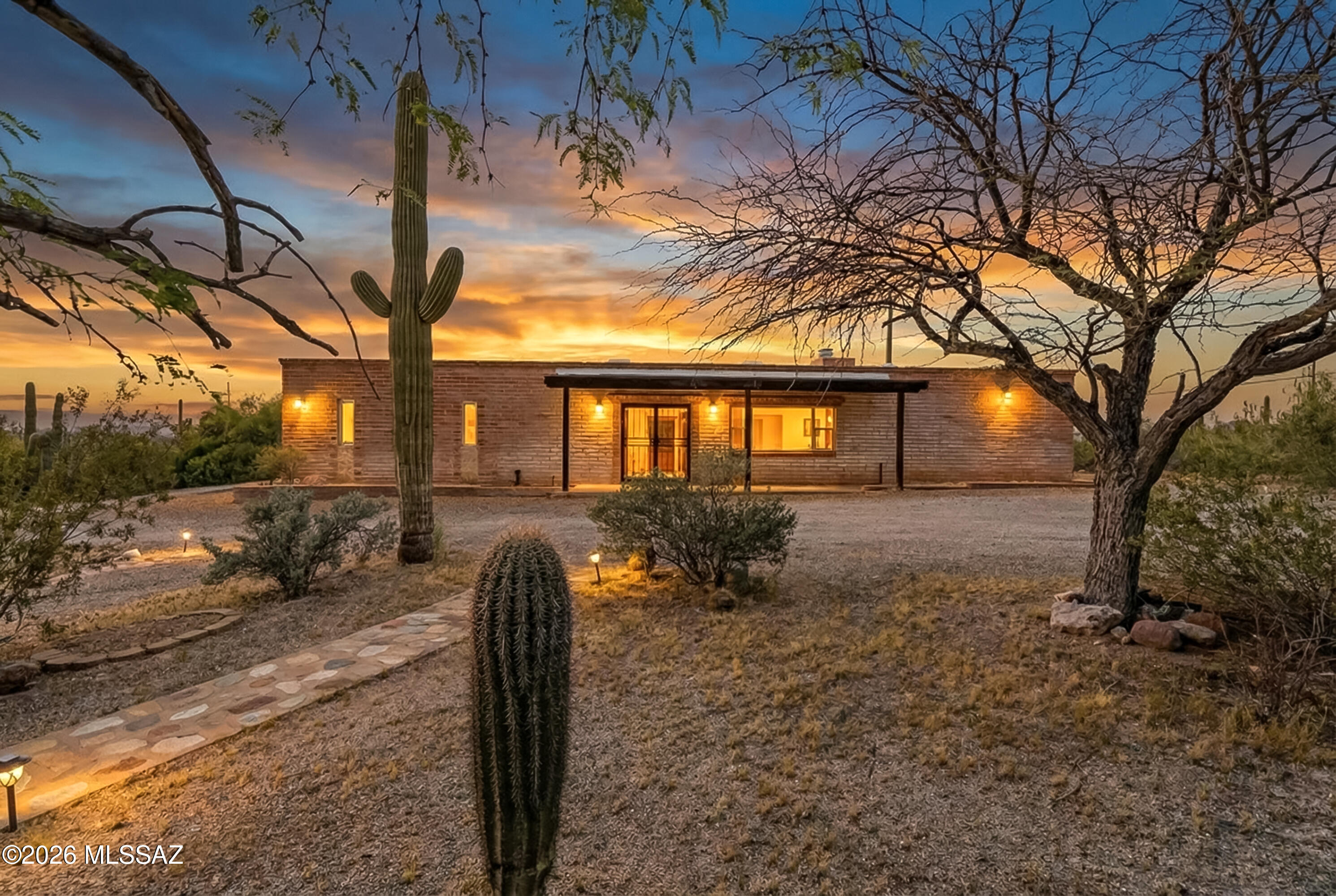 Perched to capture sweeping mountain and sparkling city light views, this beautifully updated property blends comfort, function, and outdoor living. 

Inside, the remodeled kitchen features quartz countertops and opens to multiple living areas, creating plenty of space to gather, relax, and entertain. The spacious primary suite offers a private retreat, while the backyard is designed for easy enjoyment with a sparkling pool. 

Step outside and enjoy your own private walking path winding through the property, perfect for morning strolls, taking in the views, or unwinding at sunset. Car lovers, hobbyists, and horse enthusiasts will appreciate the incredible versatility of the property, including a detached 60' x 29' garage/workshop complete with its own half bath!