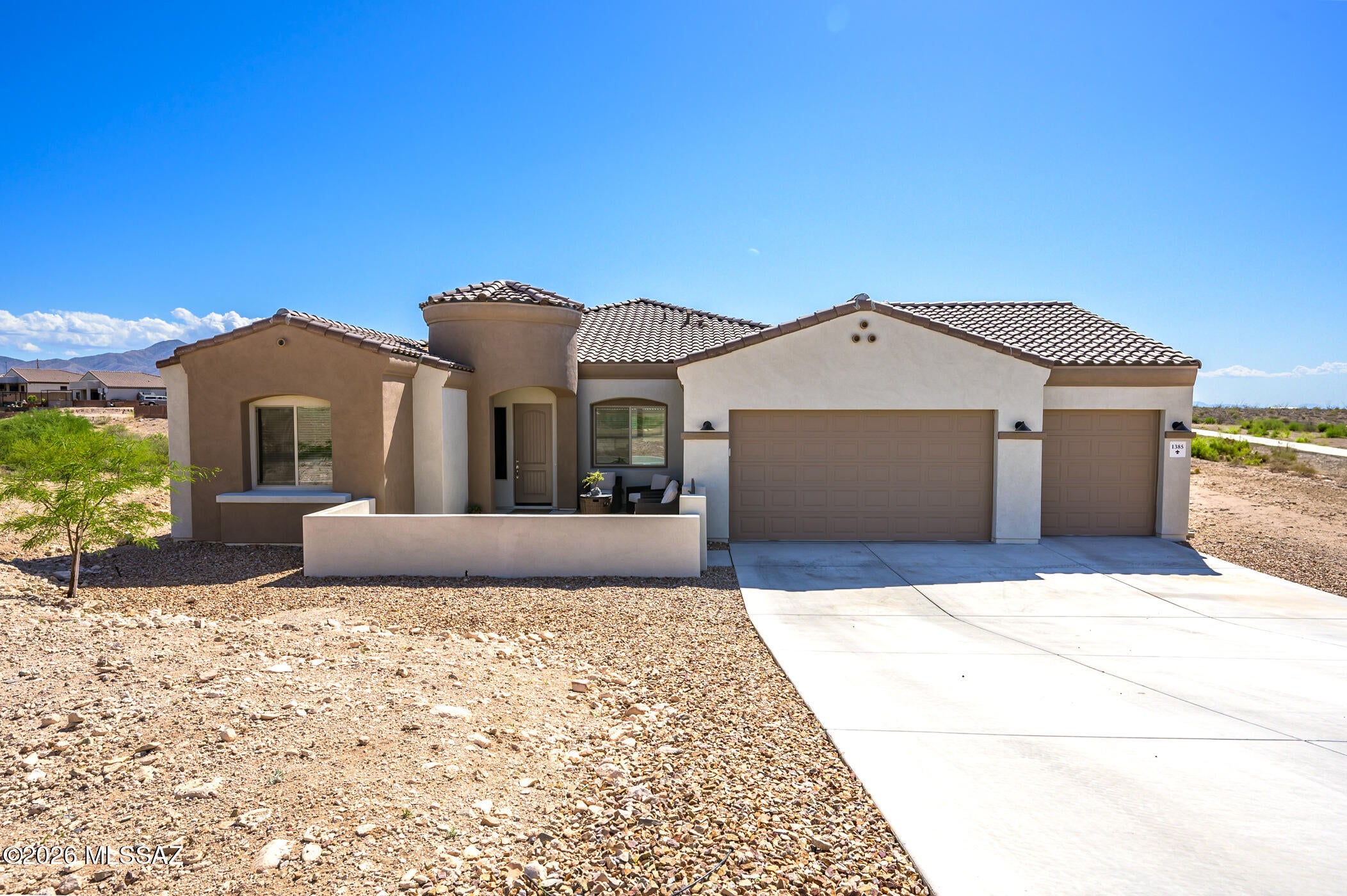 Sellers need to transition and welcome offers! Rate buydown available with preferred lender. Beautiful newer construction on nearly an acre in sought-after Vail. Spacious 3 bed + den, 2 bath, 2,439 sq ft with open concept, high ceilings, abundant natural light, and tasteful finishes. 3-car garage with 4 ft extension. Versatile den works as office, playroom, or guest space. Large kitchen opens to the great room. Generous .90 acre lot with mountain and desert views, room for RV parking, toys, or future outdoor additions. Peaceful living with space and privacy, close to Vail schools, shopping, dining, and I-10.