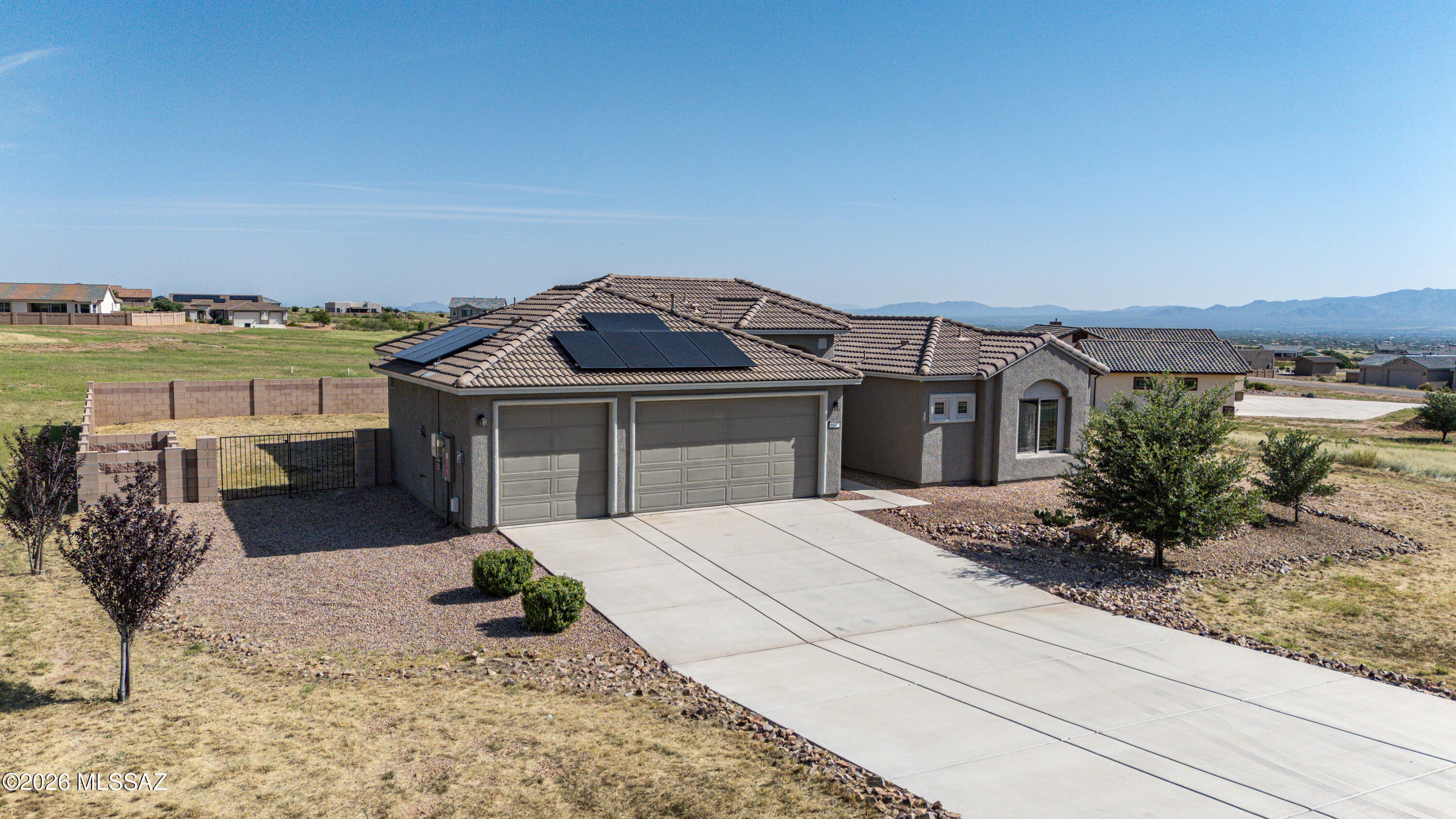Welcome to this stunning 3-bedroom, 2-bathroom home in the prestigious Kings Ranch Subdivision, where solar efficiency meets panoramic mountain views. Designed for comfort and entertaining, this beautiful home features granite countertops throughout and a cook's dream kitchen with abundant cabinetry, soft-close doors and drawers, and a spacious layout that flows seamlessly into the open great room. A spectacular wall of glass doors fills the living space with natural light and provides breathtaking views of the backyard and surrounding mountains. Step outside to enjoy the large covered patio--perfect for relaxing, dining, or entertaining while taking in the beautiful Arizona scenery.