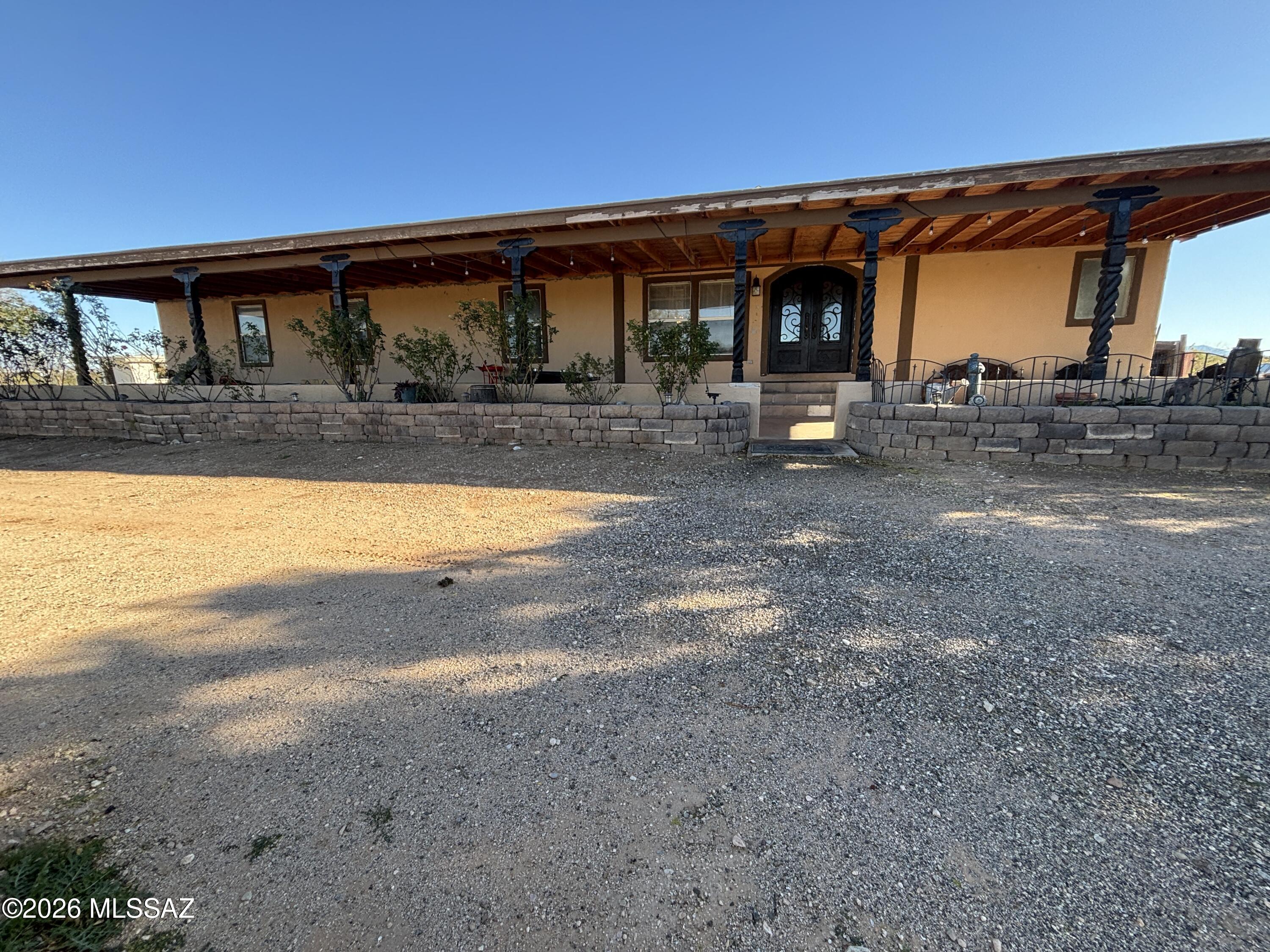 Welcome to your private slice of Tucson tranquility. This beautifully maintained home is 2,240 square feet and features 4 spacious bedrooms, 2 full bathrooms, and a versatile den with the ability to be 5th bedroom. The split floorplan features a Living room and family room, and custom kitchen. With over 4 acres of horse property that is landscaped with mature fruit trees, lush rose bushes, and decorative trees that create a peaceful atmosphere. Enjoy a PRIVATE WELL (All documents will be provided)  and access to the shared well (2 water sources)  ,newly added solar, workshop/ garage, plus 1-car carport with storage, Recently painted exterior.  The possibilities are endless.  
Listing agent is related to the seller.