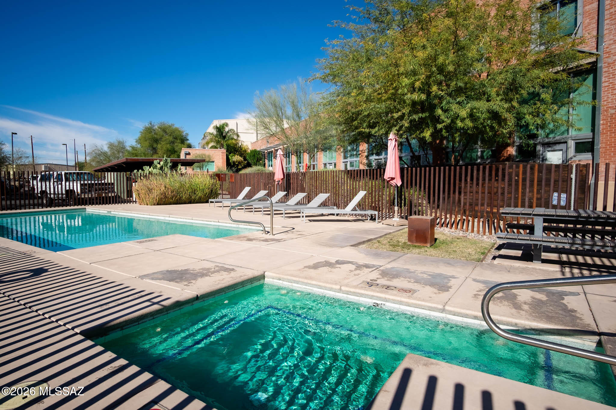 Text for a walkthrough video/more info. Enjoy Urban Loft-style Living in Tucson's Ice House Lofts. This 2nd floor Studio/1 Bathroom + Loft Space 593sf Unit has features + amenities that include: towering 2 story+ high ceilings w/ exposed beams + brick; floor to ceiling windows w/ South-facing (NOT on RR Tracks) Private Balcony overlooking shared greenspace; Walk-In Closet w/ stacked Washer + Dryer included. Community Amenities include; Gated Parking, Assigned Carport space, Pool + Spa, Fitness Room, Elevator to 2nd floor, Water/Sewer/Trash incl in rent. Located near I-10 access, Davis-Monthan AFB, Tucson International Airport, Downtown Tucson, + University of Arizona. Available immediately. 1yr minimum Lease. Costs incl; Non-refundable $50/adult Application, $1425 Security Deposit, $150/pet Pet with approved pet, $250 cleaning. Tenant pays electric.
