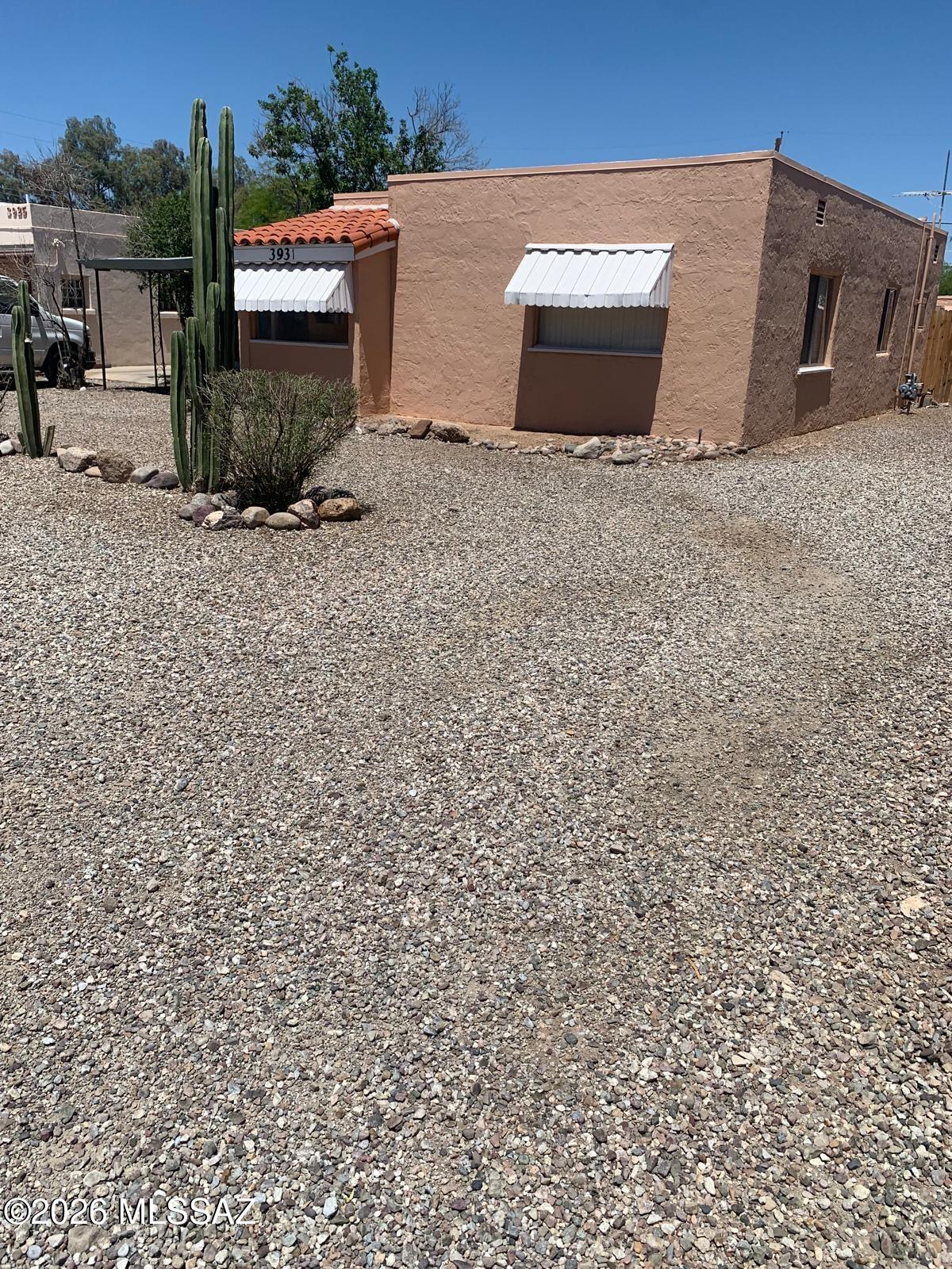 Excellent investment opportunity with this well-maintained quadruplex in a desirable rental location. Live in one unit while generating income from the other three, or add a strong cash-flowing asset to your portfolio. Property includes three air-conditioned studio units and one 2-bedroom home with central heating and air conditioning. Conveniently located near shopping, Randolph Park, and the University of Arizona, offering strong tenant appeal. Please do not disturb tenants. Shown by appointment only.