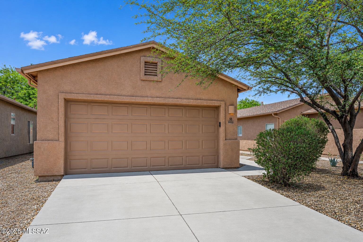 Beautifully maintained contemporary home featuring a desirable 3-bedroom, 2-bath split-bedroom floor plan that offers both comfort and privacy. The spacious open-concept design is highlighted by high ceilings, abundant natural light, and ceiling fans throughout. The well-appointed kitchen boasts ample cabinetry, generous counter space, all appliances, and opens seamlessly to a welcoming dining area, creating the perfect space for everyday living and entertaining. The spacious primary suite serves as a private retreat with a large walk-in closet and an ensuite bath featuring a walk-in shower. Two additional bedrooms are thoughtfully situated on the opposite side of the home, providing flexibility for guests, family, or a home office. Step outside to your backyard oasis featuring an extended covered custom paver patio complete with a built-in BBQ--ideal for year-round outdoor dining, entertaining, or simply relaxing. Located within a private community and conveniently close to shopping, dining, parks, and everyday amenities, this move-in-ready home offers the perfect blend of style, comfort, and functionality. Don't miss this exceptional opportunity!