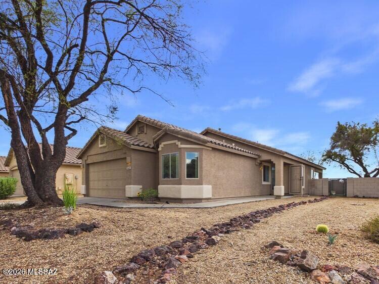 Impeccably maintained and truly move-in ready, this beautiful 4-bedroom, 2-bath home is perfectly situated on a premium corner lot with stunning mountain views. Fresh interior paint and newer carpet installed in November 2025 give the home a crisp, updated feel. The bright, open floor plan offers comfortable living with a spacious living area just off the kitchen, a cozy breakfast nook, and a well-appointed kitchen featuring stainless steel appliances, a gas range, and a pantry. The split-bedroom layout includes a relaxing primary suite with a soaking tub and separate shower. Step outside to a covered patio and enjoy a generously sized, low-maintenance backyard complete with your own private putting green and breathtaking mountain views, perfect for entertaining, relaxing, or enjoying Arizona's beautiful weather. Additional highlights include tile roofing, block fencing, an attached 2-car garage with an electric opener, decorative gravel landscaping, mature trees, and access to a neighborhood park. This meticulously cared-for home is the perfect combination of comfort, functionality, and outdoor living. Don't miss your opportunity to make it yours! Schedule your private showing today!