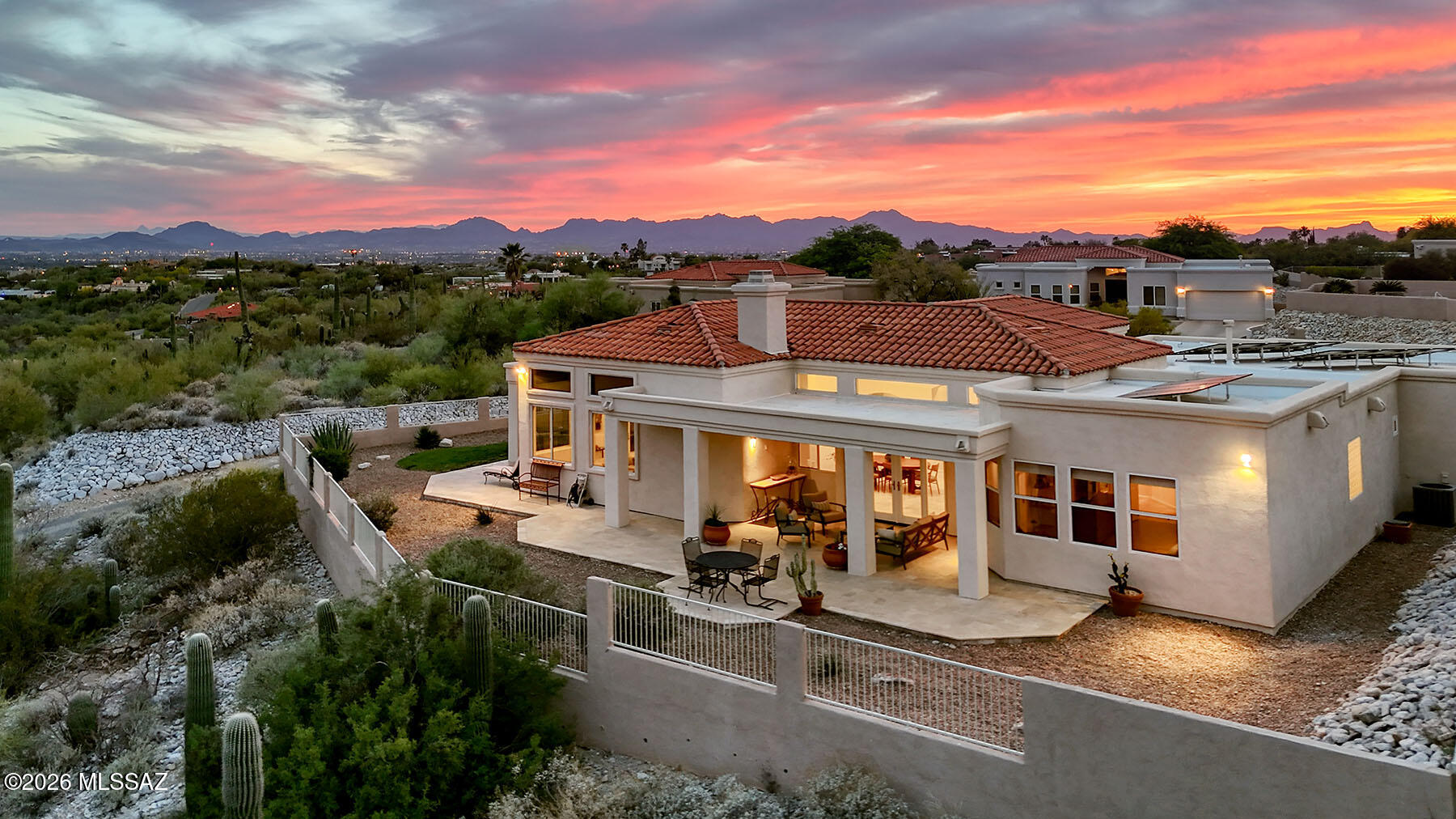 Luxury Living at its best with SPECTACULAR Tucson city views! This stunning single-story residence features 4 bedrooms, 3 bathrooms, 2670 S.F. & a 3-car garage all nestled at the end of a cul-de-sac in the prestigious gated enclave of the Estates of Salida del Sol. Built in 1999, this original owner home is infused with natural light & offers many of today's modern conveniences. As you enter the residence, the welcoming living spaces provide both openness and immense natural light with soaring ceilings, large windows, glass doors & clerestory windows.  The chef's kitchen is equipped with rich maple cabinetry, granite counters, large granite center island with bar style seating, stainless steel side-by-side refrigerator (which conveys), gas cooktop, microwave, closet pantry and a cozy eating area.  The impressive primary suite features double vanities, glass shower enclosure, separate jetted tub, spacious walk-in closet, large picture windows and access to the outdoor patio.  Split bedroom floor plan. Many, many upgrades including owned solar, EV charging, plantation shutters, two zoned HVAC units, separate laundry room with sink & plenty of cabinets, grassy area with drip irrigation, multiple ceiling fans, recessed lighting, travertine floors - and more! Resort style backyard showcases multiple outdoor patio seating possibilities designed for both family & friends gatherings or quiet solitude, view fencing and a fully enclosed backyard.  Enjoy year round entertaining & outdoor dining on the wrap around patios while immersing yourself in the beauty of the Sonoran Desert with its lush vegetation, saguaro cacti & natural wildlife. District 16 Schools. 
Truly an exceptional property.