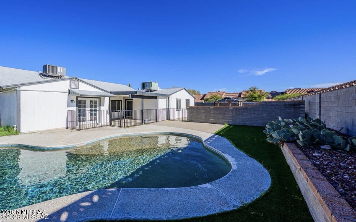 Remodeled and move-in ready, this exceptional Saddlewood Ranch home offers 4 bedrooms, 3 full bathrooms, and 1,955 square feet of inviting single-level living. Highlights include a new roof, RV parking, spacious living and family rooms, a private primary suite with walk-in closet, and a flexible fourth bedroom perfect for guests or a home office. The generous backyard with covered patio provides the ideal space for entertaining and enjoying Tucson's beautiful weather. Conveniently located near schools, shopping, dining, parks, and freeway access, this home combines style, comfort, and everyday convenience.