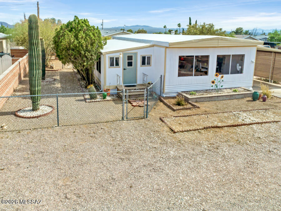 Outstanding north facing furnished home completely updated and renovated with great mountain views. Flooring, kitchen, both bathrooms; all updated. Kitchen has quartz counter tops and soft close cabinets. Water heater is one month old. A 10x30 AZ room with a 220 amp wall AC unit can be used however a buyer sees fit. Great corner lot! Extra room in the front for a deck and also extra space behind home. Located in an active 55+ community, the HOA fee includes unlimited golf, tennis, pickleball, shuffleboard, pools, spa, fitness center, trash service, and much more. Best of all--you own the land. This is carefree living at its finest.