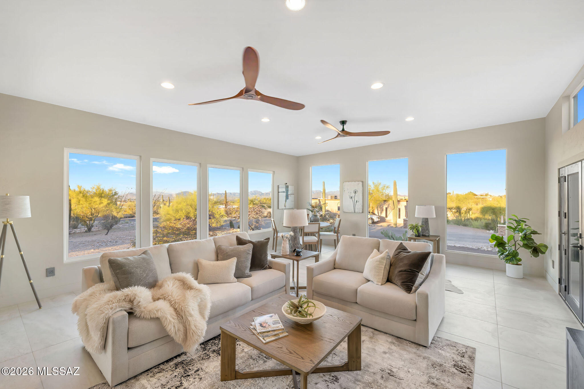 This beautifully curated Catalina Foothills residence offers the rare opportunity to own a home where quality, comfort, and intentional design come together seamlessly. Situated on nearly an acre in a highly desirable location, the property provides privacy along with stunning mountain, city, and sunset views.

Inside, natural light fills the home, highlighting a modern aesthetic with warm, inviting finishes. The kitchen serves as a true centerpiece, featuring designer touches and a custom double-domed skylight that brings in an abundance of natural light--perfect for both everyday living and entertaining. Expansive windows frame the surrounding landscape, creating a seamless connection between indoor and outdoor spaces.

Extensive improvements have been completed, offering peace of mi and long-term value, including a full home repipe, updated roof, dual-zone HVAC systems, new electrical panels, energy-efficient windows and sliders, lifetime warranty hot water heater, and an owned solar system. The finished garage adds functionality with insulation, upgraded lighting, an EV charger, epoxy floors, and two-unit laundry room. 

The spacious lot creates a sense of privacy and openness while preserving a low-maintenance, move-in ready lifestyle. Smart home features deliver seamless control of lighting, climate, and appliances for a more effortless way of living.

A complete list of upgrades and warranty information is available. This is a unique opportunity to own a thoughtfully curated, move-in ready home in the Catalina Foothills--designed for effortless living from day one.