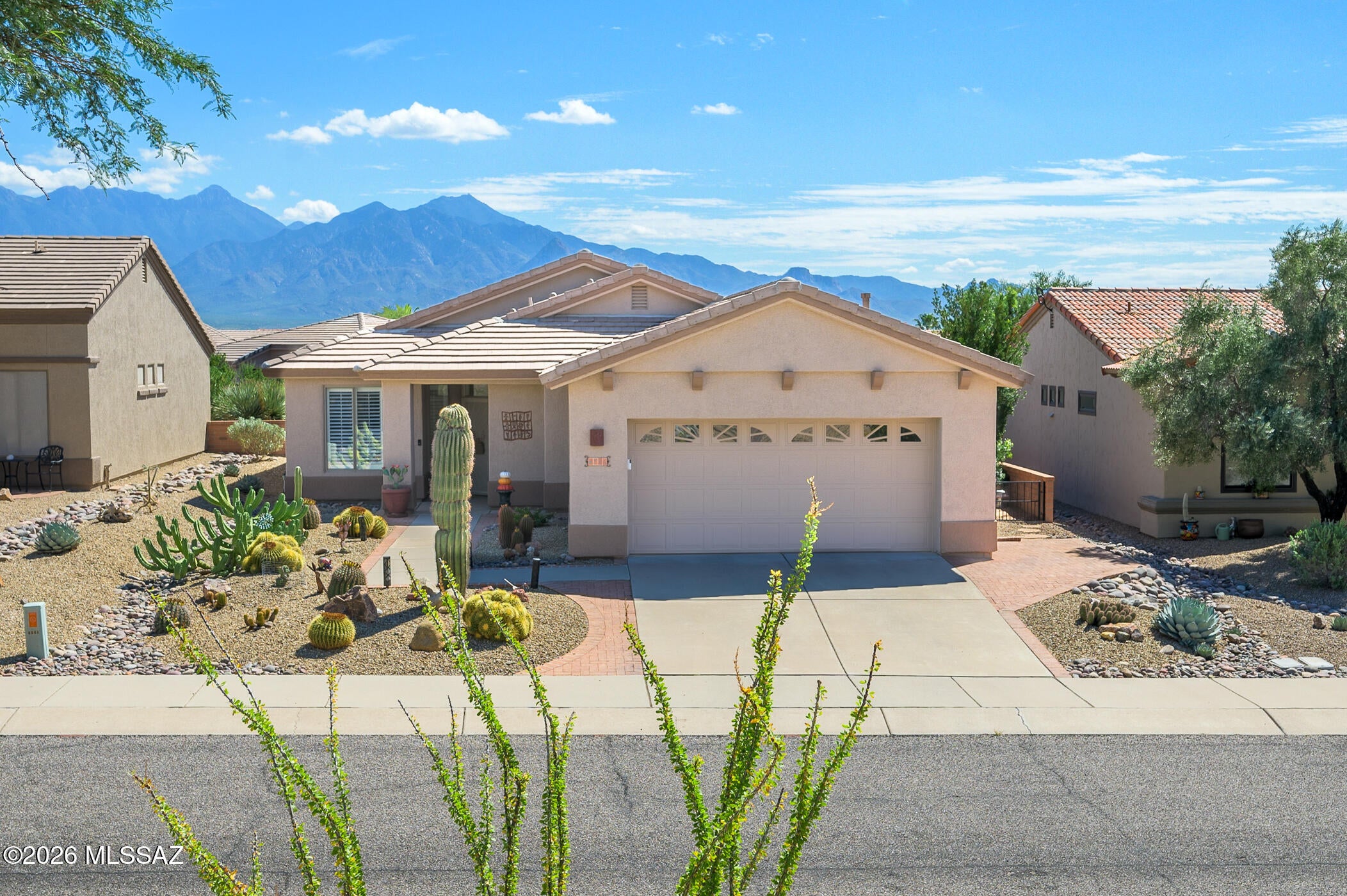 Enjoy the relaxed Southwest lifestyle in this beautifully updated home in desirable San Ignacio Vistas II, conveniently located near golf, shopping, recreation centers, and all that Green Valley has to offer. Thoughtful updates make this home truly move-in ready, including fresh exterior and interior paint in 2025, a roof replaced in 2021 with additional tile and mortar repairs completed in 2025, new plantation shutters, and a new oven. 

Inside, tile flooring flows through much of the home, while a flexible den with double doors is ideal for a home office, TV room, or hobby space. The updated kitchen features quartz countertops, stainless-steel appliances, tile backsplash, updated fixtures, and under- and over-cabinet lighting. The spacious primary suite features a bay window and remodeled bath with updated countertops, antiqued copper sinks, separate shower, and soaking tub. A comfortable guest bedroom and updated guest bath provide plenty of space for visiting family and friends.

Outside, enjoy a private side patio perfect for grilling, relaxing, and taking in Arizona's beautiful weather and evening skies. Well maintained and thoughtfully updated, this home offers an easy-care lifestyle for enjoying retirement in Southern Arizona.
