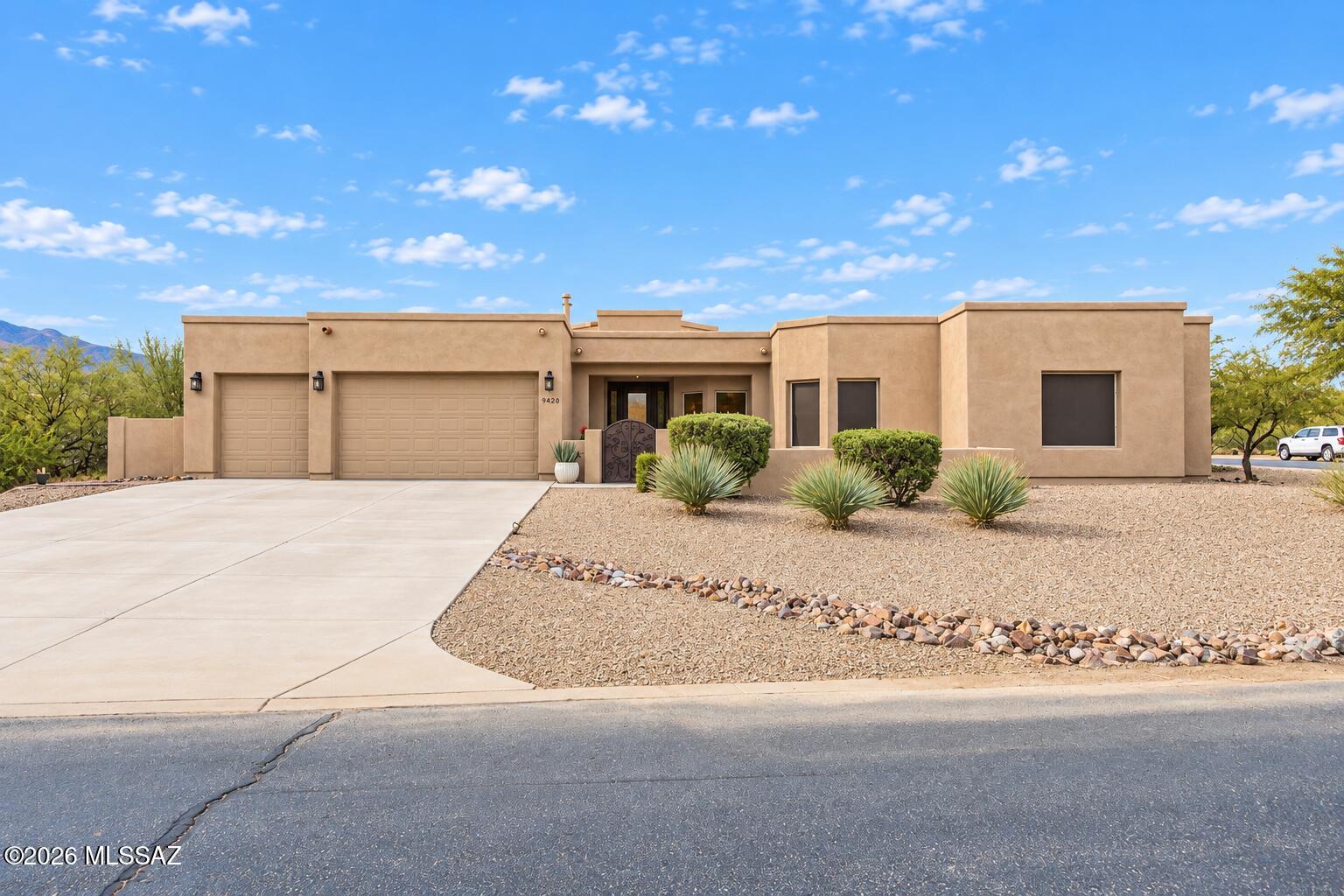 Welcome to this beautifully refreshed, move-in-ready home nestled within the desirable Sycamore Canyon community in Corona de Tucson, located in the award-winning Vail School District. This stunning Sombra, semi-custom home offers 4 spacious bedrooms, 3 bathrooms, and a separate office/den. An inviting front courtyard leads to impressive 8-foot double entry doors, opening into an expansive great room with breathtaking mountain views. The gourmet kitchen features generous wraparound countertops, stainless steel appliances, and ample space for gathering and entertaining. A thoughtfully designed split-bedroom floor plan offers comfort and privacy. Recent improvements include fresh exterior paint, including the backyard walls, professional landscaping, completed roof work, HVAC maintenance, and termite treatment, adding to the home's move-in-ready appeal. Decorative wrought iron security doors at the front and back invite refreshing desert breezes. Situated on an expansive .82-acre corner lot, the generously sized walled backyard features a covered patio with stunning mountain views, creating an inviting setting for outdoor entertaining, relaxing, or simply enjoying Arizona's spectacular sunsets. Beyond the home, Sycamore Canyon residents enjoy HOA community amenities, including a sparkling pool, neighborhood park, basketball court, and scenic walking trails. Experience the perfect blend of space, privacy, outdoor recreation, and the natural beauty of Southern Arizona living!