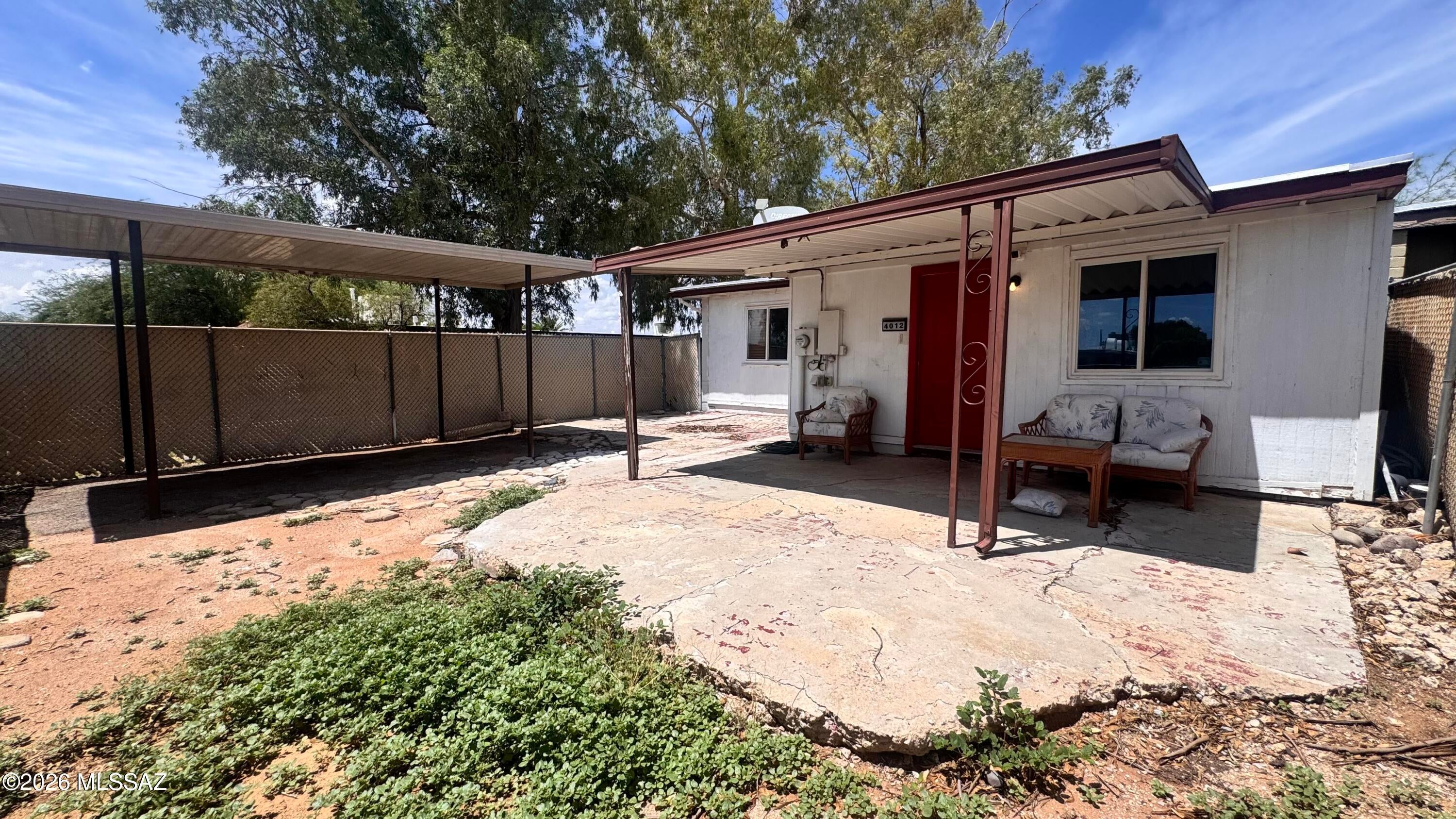 Opportunity in East Tucson! This 2-bedroom, 1-bath townhome offers 990 sq. ft. of single-level living on a corner lot with mountain views and covered parking. The home features a functional layout with a living room, dining area, bonus/storage space, dedicated laundry room, and private patio. Conveniently located near Kolb and Escalante with access to shopping, dining, schools, and major roadways. A great opportunity for a buyer looking to make a home their own or an investor seeking their next property. Sale may be subject to lender approval as a potential short sale. Property is being offered in its current condition.