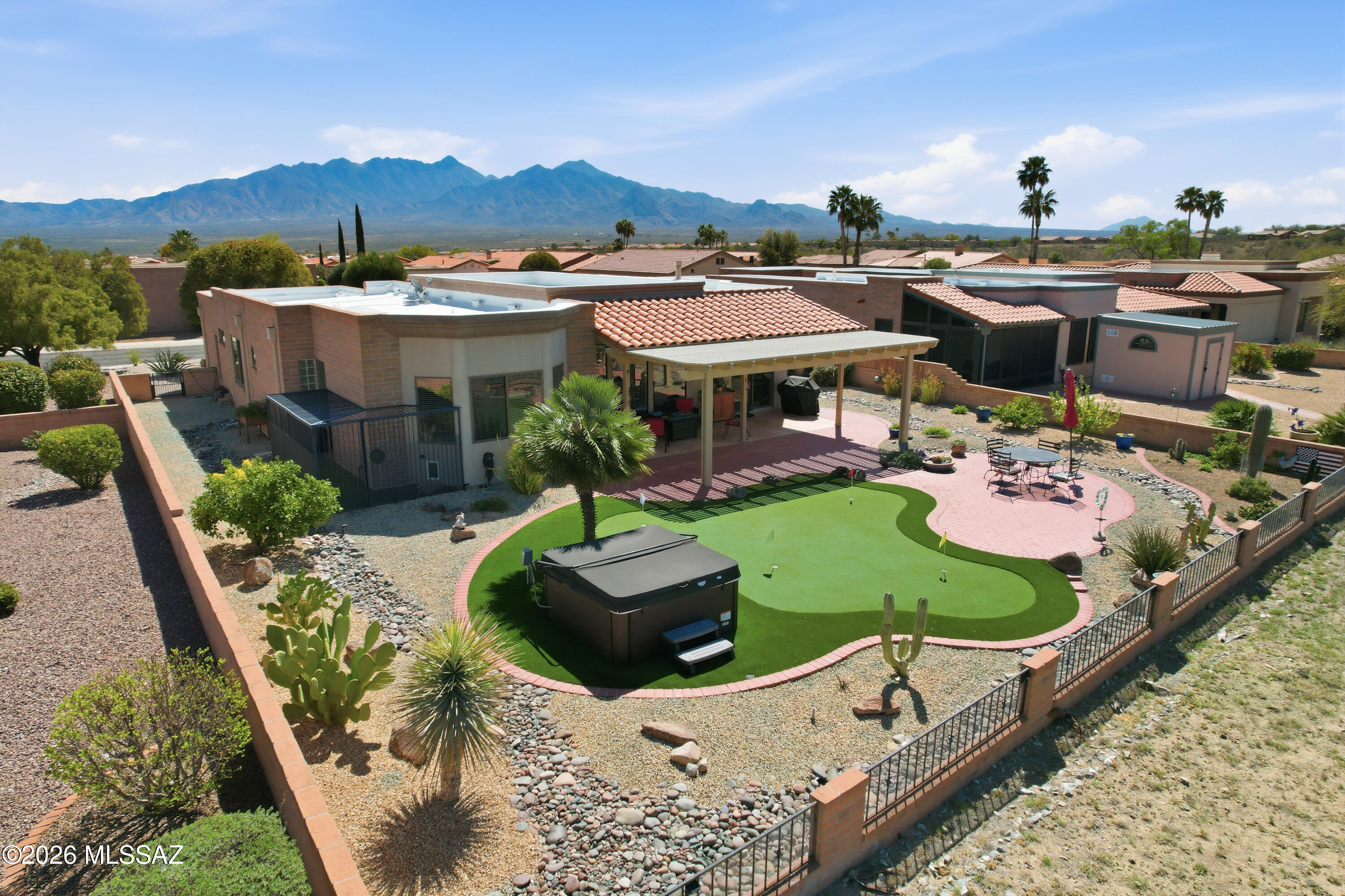 SAN IGNACIO GOLF COURSE HOME  Experience golf course living at its finest. A beautiful home, perfectly situated on a scenic fairway lot. Dramatic high ceiling Spaciousness defines this home. Natural light pours in to illuminate a free flowing, fun interior designed for conversations and connection.  Expansive kitchen, with center island and meeting bar opens seamlessly to dining and great room. Illuminated pool table game room  against a picture window frame of scenic nature views. Location lends a to beautiful blend of active adult living every day. LIFESYLE, LEISURE & LOCATION right here. Step outside onto the professionally designed astro turf putting green. Where practice makes perfect in the sunshine. For you Dog Lovers, an exclusive dog run and secure kennel offers peace of mind and safe space for Fido when temporarily unattended.  Removable carpet overlays tile floors and is optional. Feb 2026 new PEX plumbing install throughout.  Exclusively by Sue Taylor-Lane in San Ignacio Ridge Estates.