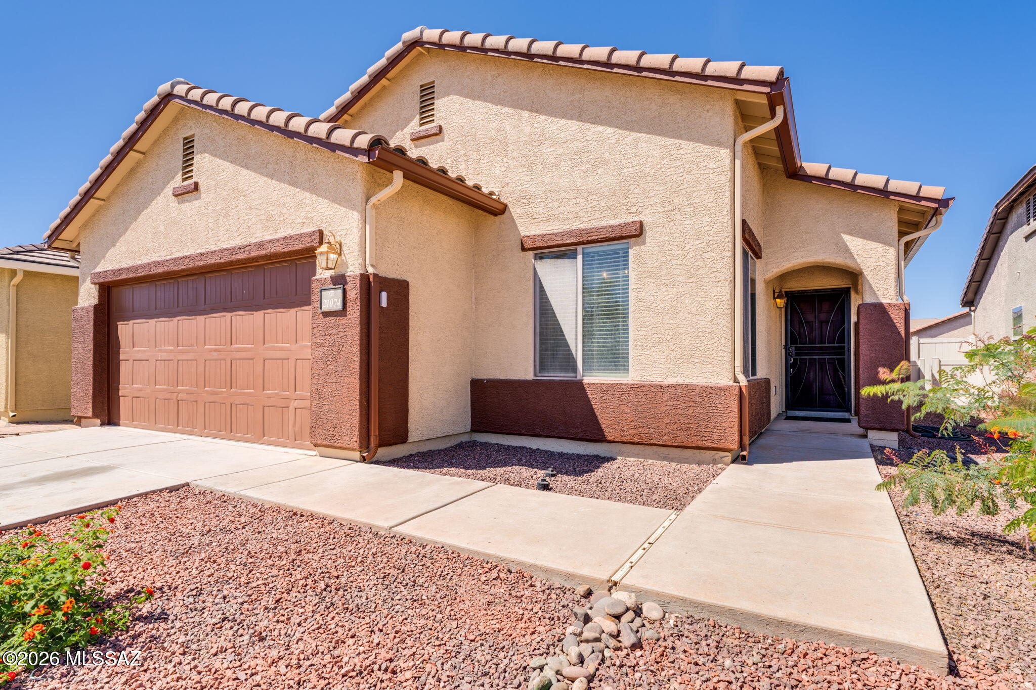 Better than the builder and thoughtfully upgraded, this turnkey home offers a level of care and readiness you don't often find. USDA approved, meaning 0% down payment for qualified buyers and truly move-in ready!!  Most major systems have already been addressed, including: A/C, updated garage door motor, stove, carpet, and fresh interior paint. The result is a home that feels refreshed, functional, and easy to step into without a long to-do list.  The layout is practical and comfortable, with spacious living spaces for both everyday living and entertaining. Natural light fills the main areas, while the updated finishes create a clean, cohesive feel throughout. The kitchen offers plenty of usable space and storage, making it as functional as it is welcoming. The bedrooms are comfortably sized, and the primary offers a double vanity and walk-in shower.  Located in a quiet Red Rock setting, this master-planned community offers amenities like a resort-style swimming pool with water slides, a splash pad, a skate park, basketball courts, baseball fields, sand volleyball, and picnic ramada area, walking trails, and on-site schools.  If you're looking for a home to call your own, this one is it!!