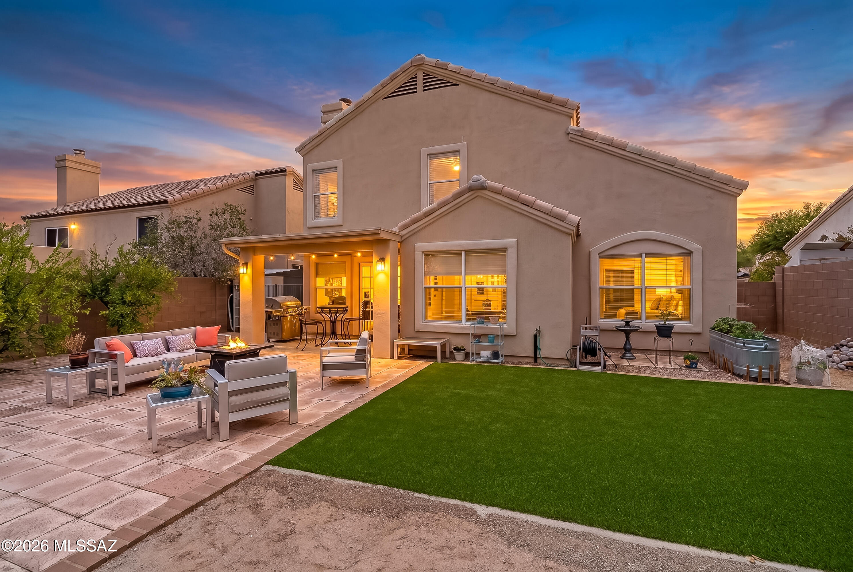 Situated in the Catalina Shadows neighborhood of Oro Valley, this three-bedroom, two-and-a-half-bath home backs to open space and captures stunning mountain views in a serene setting. Whether you are enjoying a cup of coffee or walking the sidewalk lined streets, the setting of this home offers tranquility and convenience.
Inside, the layout opens to a bright living room with vaulted two-story ceilings and an adjacent dining area suited for gatherings. The kitchen features quartz countertops, soft-close cabinetry with pull-outs, a pantry, and a breakfast nook, offering both function and style. The breakfast bar easily accommodates 2 or 3, while copious built in bookcases add to both storage and ambiance. A main-floor half bath and interior laundry closet add convenience.
With updated flooring throughout, the home has a consistent, low-maintenance feel. The primary suite includes an expansive walk-in closet and a bathroom with quartz counters, dual sinks, a garden tub, separate shower, toilet room, and custom tile work.
Outdoor spaces are designed for year-round use, with a covered porch, pristine turf lawn, and open views toward the mountains. Additionally, the absence of polybutylene plumbing, provides added confidence in the home's infrastructure.
With its combination of updates, efficient layout, and a setting that opens to our beautiful Sonoran landscape, this property offers a comfortable and practical option in a sought-after Oro Valley location.