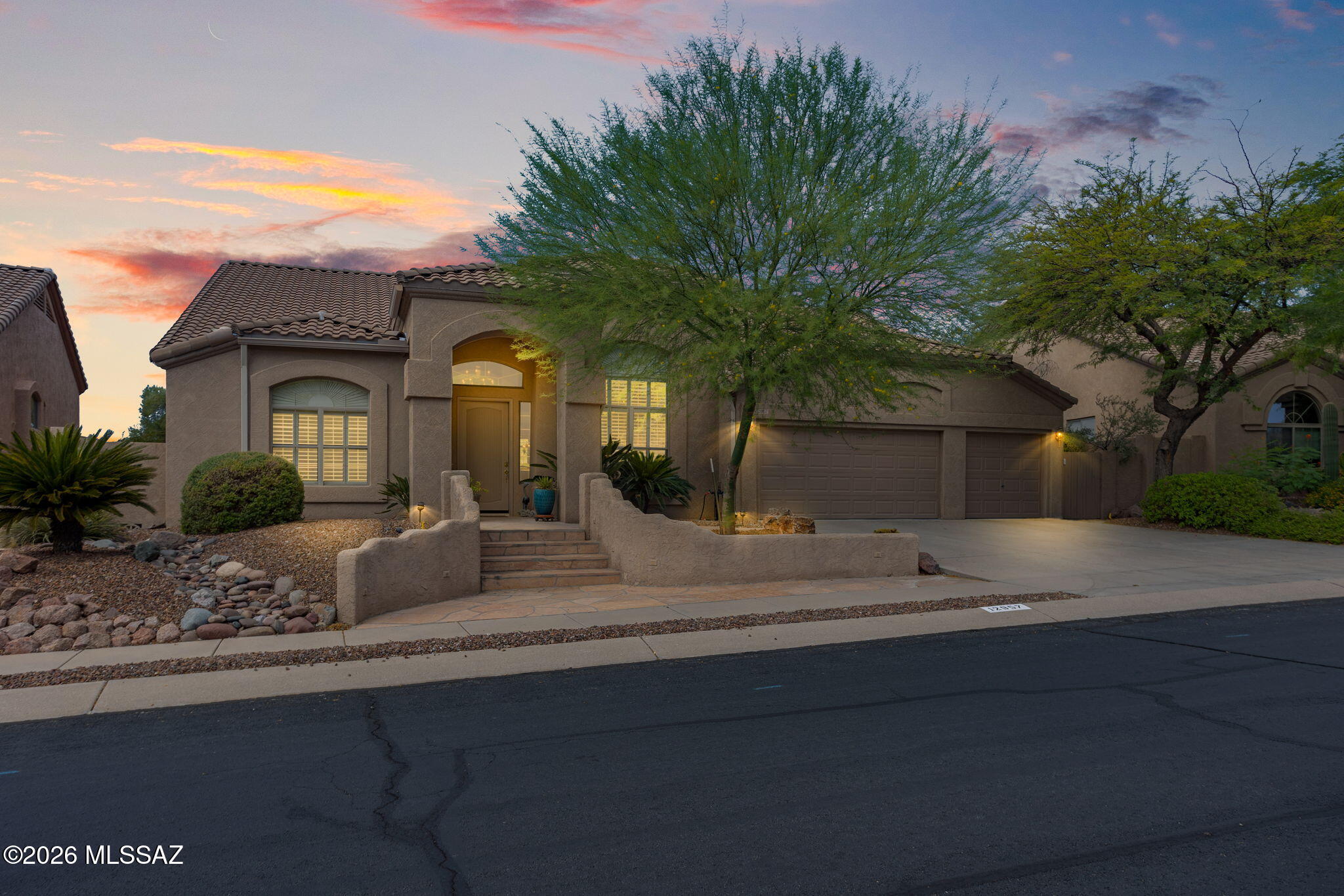 Welcome to this beautifully designed home nestled in the highly sought-after Rancho Vistoso community, where timeless architecture meets exceptional indoor-outdoor living. From the moment you step inside, you'll be captivated by soaring ceilings, expansive windows, and an abundance of natural light that showcases the beautifully landscaped backyard.

Designed for both everyday living and entertaining, this spacious floor plan features formal living and dining rooms, a private den with custom built-in bookcases, and an oversized family room complete with a wet bar and cozy gas fireplace. The well-appointed kitchen offers a center island, generous pantry, nearly new stainless steel appliances, and a charming breakfast nook overlooking the sparkling heated saltwater Pebble Tec pool, efficiently warmed by solar pool heating collectors for extended year-round enjoyment.

The secluded primary suite is a peaceful retreat featuring dual vanities, a spacious walk-in closet, a generous shower, and private access to the covered patio.

Step outside to your own private backyard oasis. Enjoy the heated saltwater Pebble Tec pool, built-in BBQ, lush landscaping, mature fruit trees, and a serene setting that backs to natural vegetation for added privacy. The solar pool heating system helps maximize swimming comfort while improving energy efficiency. An extended covered patio provides the perfect setting to relax, entertain, and take in the beauty of the garden-like surroundings with desirable southern exposure.

Located in the beautiful Rancho Vistoso community, you'll enjoy scenic mountain views, miles of walking and biking trails, nearby golf courses, parks, shopping, dining, and easy access to everything Oro Valley has to offer.

This home offers a rare combination of dramatic architectural design, thoughtfully designed living spaces, and resort-style outdoor amenities--creating a lifestyle you'll love coming home to.