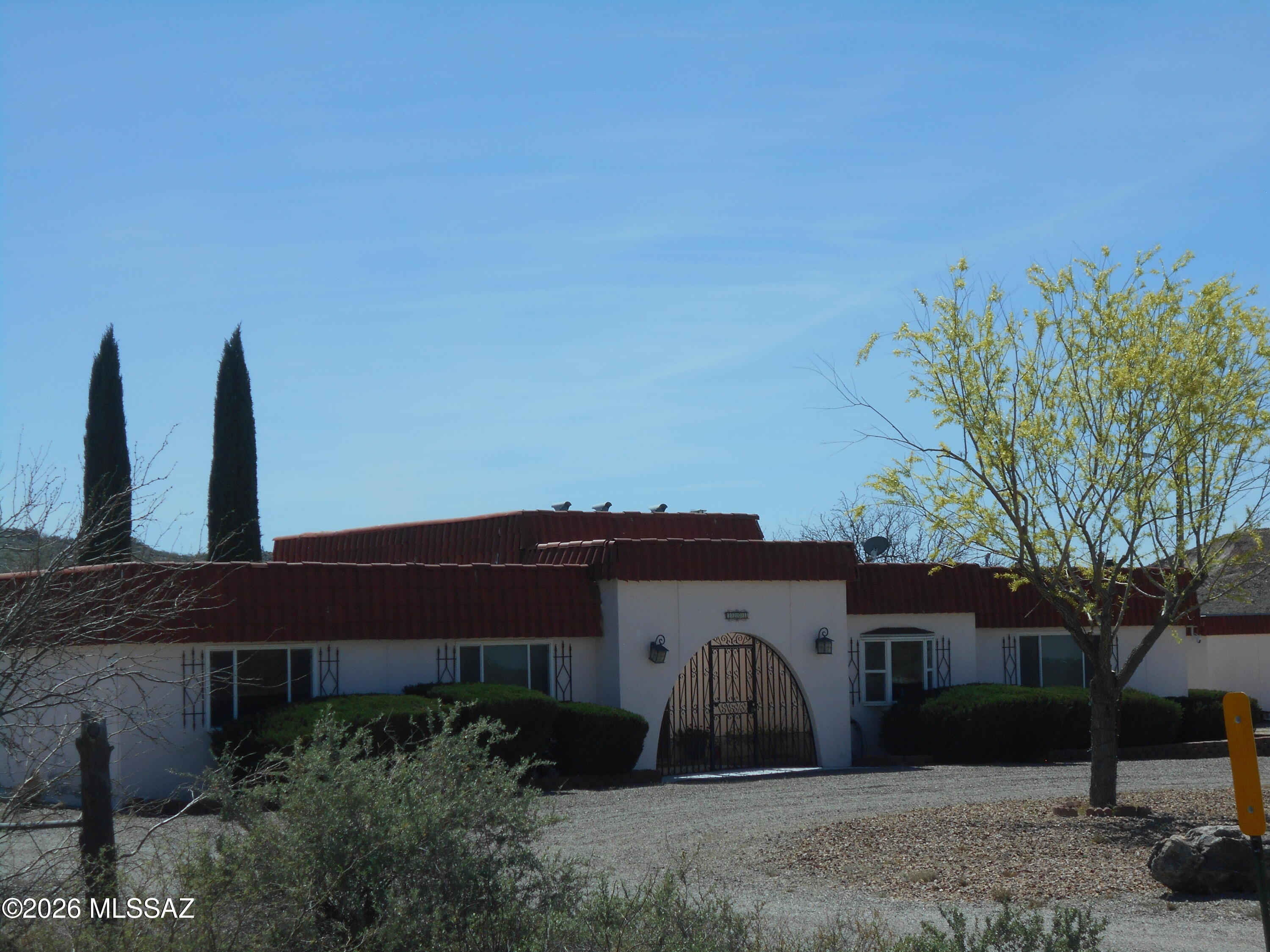 ANOTHER PRICE REDUCTION!!! Beautiful, spacious, 3bd, 2ba home with lovely views and easy access to Interstate 10 and the city of Willcox. This very nice house has been updated and so well taken care of that it feels like a new home!  New appliances in the kitchen, lovely wood beams on the ceiling in the living room and dining room area. It sits on 5 usable acres and with paved access, and a short distance to Interstate 10, so it's convenient to wherever you need to go! Sit on your back porch and enjoy your beautiful lawn with irrigation system and fenced-in yard, while you enjoy the spectacular Arizona sunsets! Nice large workshop, chicken pen, and plenty of room for all your barnyard friends! This is a super nice home in the country, and you don't want to miss this opportunity!!