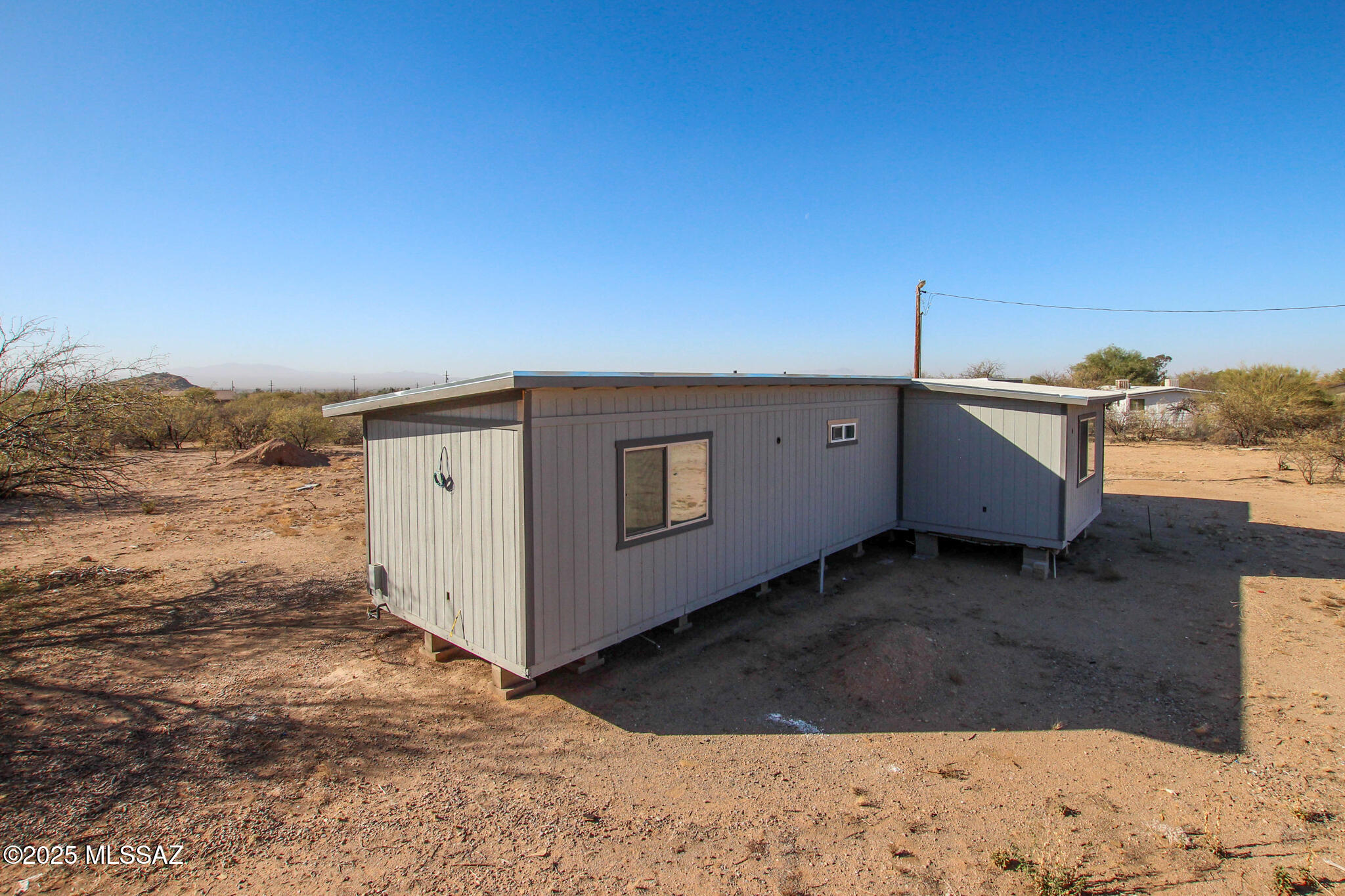 **''Opportunity is knocking in Tucson's desirable Southwest area!** This affixed mobile home sits on an expansive 1.24-acre lot with the potential to accommodate a second home--perfect for multi-generational living, rental income, or future development.
Major upgrades have already been completed, including new framework, sheetrock, electrical, and plumbing, along with a newer roof, new doors, and fresh interior and exterior paint. The heavy lifting is done now it's your chance to bring the vision to life. Whether you're an investor looking for your next project or a homeowner ready to customize your dream space, this property offers incredible upside, flexibility, and value. Don't miss the chance to turn this promising property into something truly special!