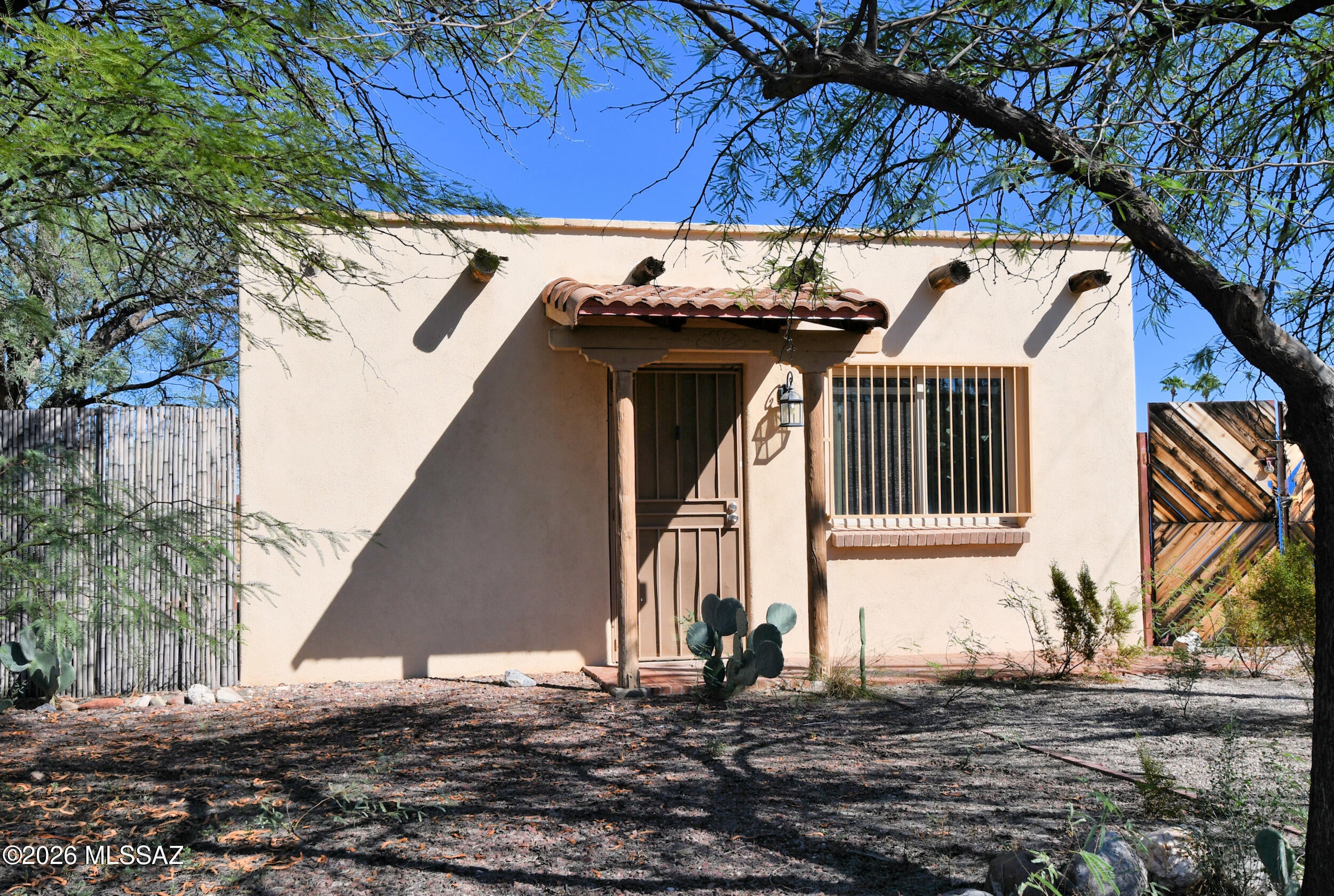 Old Timey, 1947 Masonry Stucco Casita hidden away on a tiny street, but so near River Rd, Brandi Fenton Memorial Park, JCC & Central Tucson! This is the one you've been waiting for! Huge, fenced 9000sf lot! NO HOA! Double Gate into the backyard. Detached, brick hobby house w/carport! There's even a Peek-a-boo mountain view! Pets, projects bring them in! R-2 zoning! Maybe add an ADU! Central AC! Natural Gas! Updated Vinyl Clad Windows! Tile floors in living areas. 2 Bedrooms with bath in the middle. Bonus room on the rear of the home is a great size, has a laundry and opens to the backyard! This home has been pre-inspected. Download or request it by email. It's a charming home but, needs repairs that sellers are unable to perform. Offered as-is. Cash or private funded loans considered.