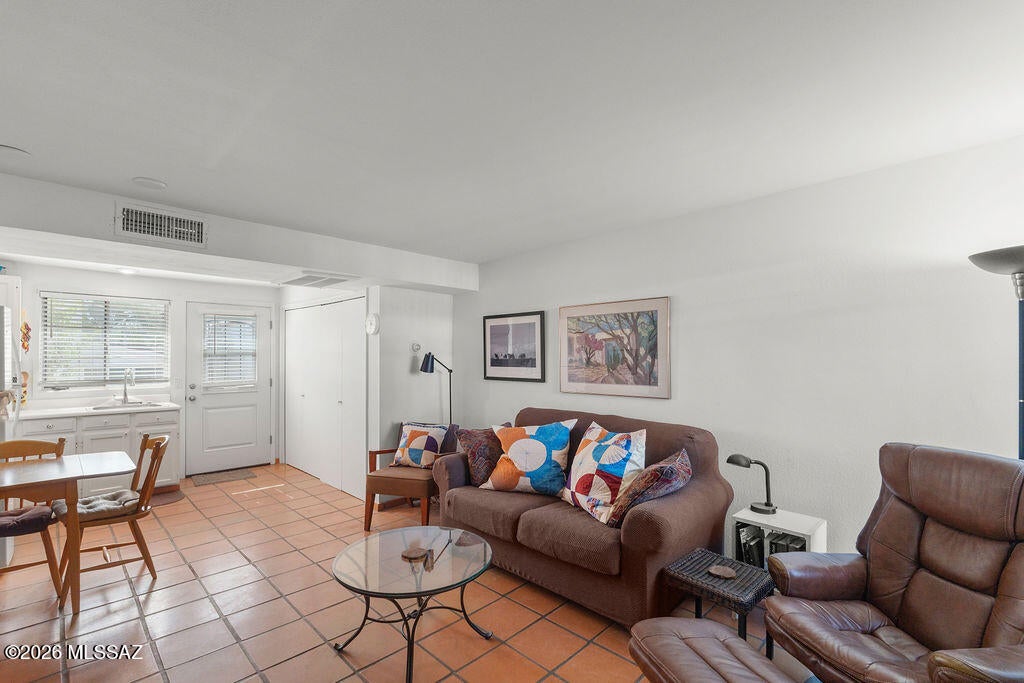 Welcome to this charming 1-bedroom, 1-bathroom condo in Villas East, offering comfortable, low-maintenance living in a welcoming setting. Beautiful Saltillo tile flows throughout the home, adding warmth and classic Southwest character. Step outside to the front patio, the perfect spot to relax, unwind, and enjoy Arizona's beautiful sunsets. Whether you're looking for a seasonal retreat or a full-time residence, this inviting condo is ready to welcome you home!