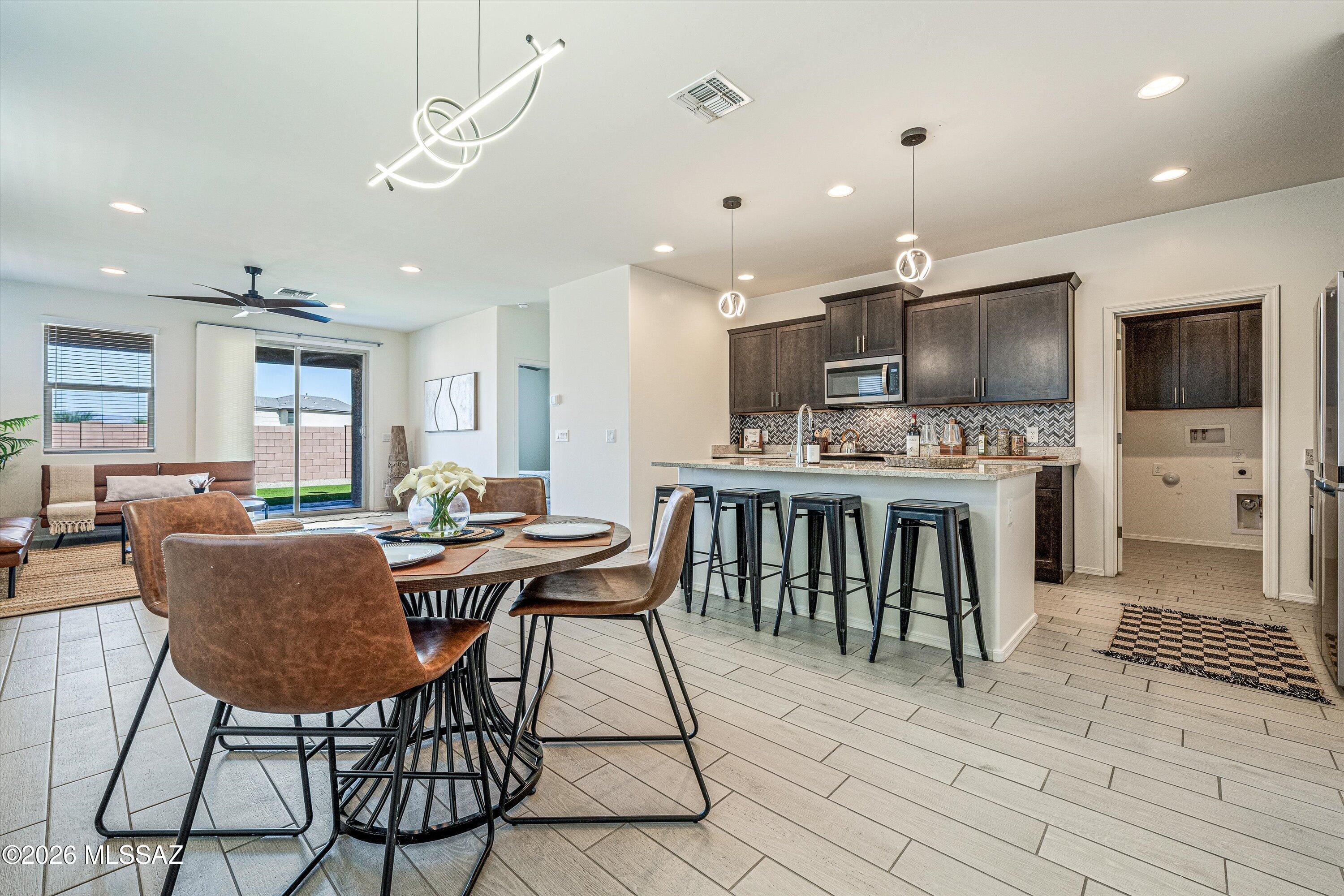 PRIMARY ON THE 1ST FLOOR & NO BACK NEIGHBORS! This smart home features, meaningful upgrades and an outdoor space with tons of possibilities! Where thoughtful upgrades, and inviting outdoor living come together in the desirable Vail community. You get what you pay for and this home delivers features that make a difference! an updated kitchen, water softener and a landscaped backyard ready for relaxing evenings, weekend barbecues, and memorable gatherings. There's even room to envision a future pool and create the backyard retreat you've always dreamed of. Located within the highly rated Vail School District, Be part of a community where education and community connection are part of the appeal. If you're looking for the perfect place to call HOME, call and schedule your private TODAY!