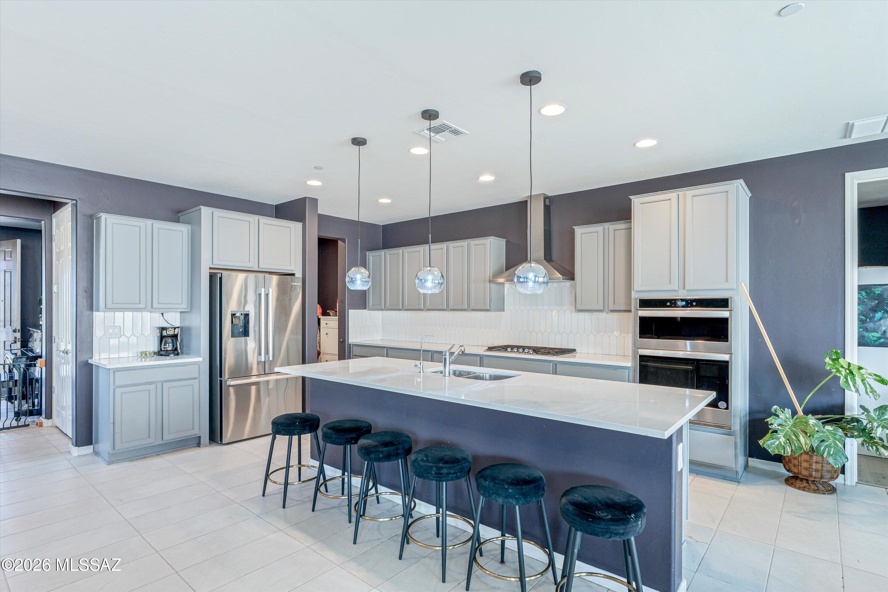 4.25% Assumable Loan to any qualified va AND non va buyer. $413K left on loan. 5 bedroom, 3.5 bath home with large loft. 4 bedrooms upstairs with huge loft. One 
ensuite bedroom with full bath downstairs! 2 downstairs living areas (One set up as a library), long kitchen island with space for 6 barstools. Dining area can support a table for ten.  Upstairs laundry room is plumbed for sink. Huge closet under the stairs. Backyard is an oasis of desert plants and fruit trees - lemon, lime, orange & an overachieving pomegranate! Built in BBQ, artificial turf. No neighbors across with beautiful views of the mountains. Solar Loan at $266 payment.