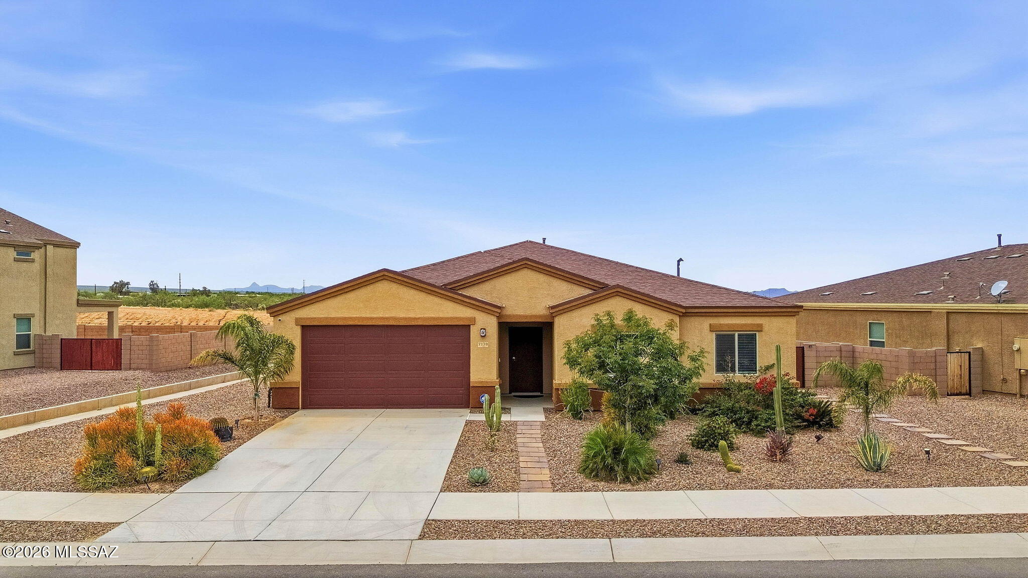 This Southwest, single-story gem offers 3 bedrooms, 2-baths, a modern open concept with ceramic tile throughout and carpet in bedrooms. You'll love the spacious living area perfect for gatherings and relaxing days at home. The fireplace insert provides a warm ambiance on those cool Tucson winter nights. Step out to a beautiful desert landscaped front and back yard.  Enjoy endless panoramic sunset views while entertaining or just stargazing and enjoying your spacious backyard.  The double gate entry to the backyard will come in handy.  And yes, this HOA allows you to keep your RV in your backyard!  Located just minutes from the Casino Del Sol and shopping is only 15 minutes away! Some furniture is available for sale on a separate bill of sale.