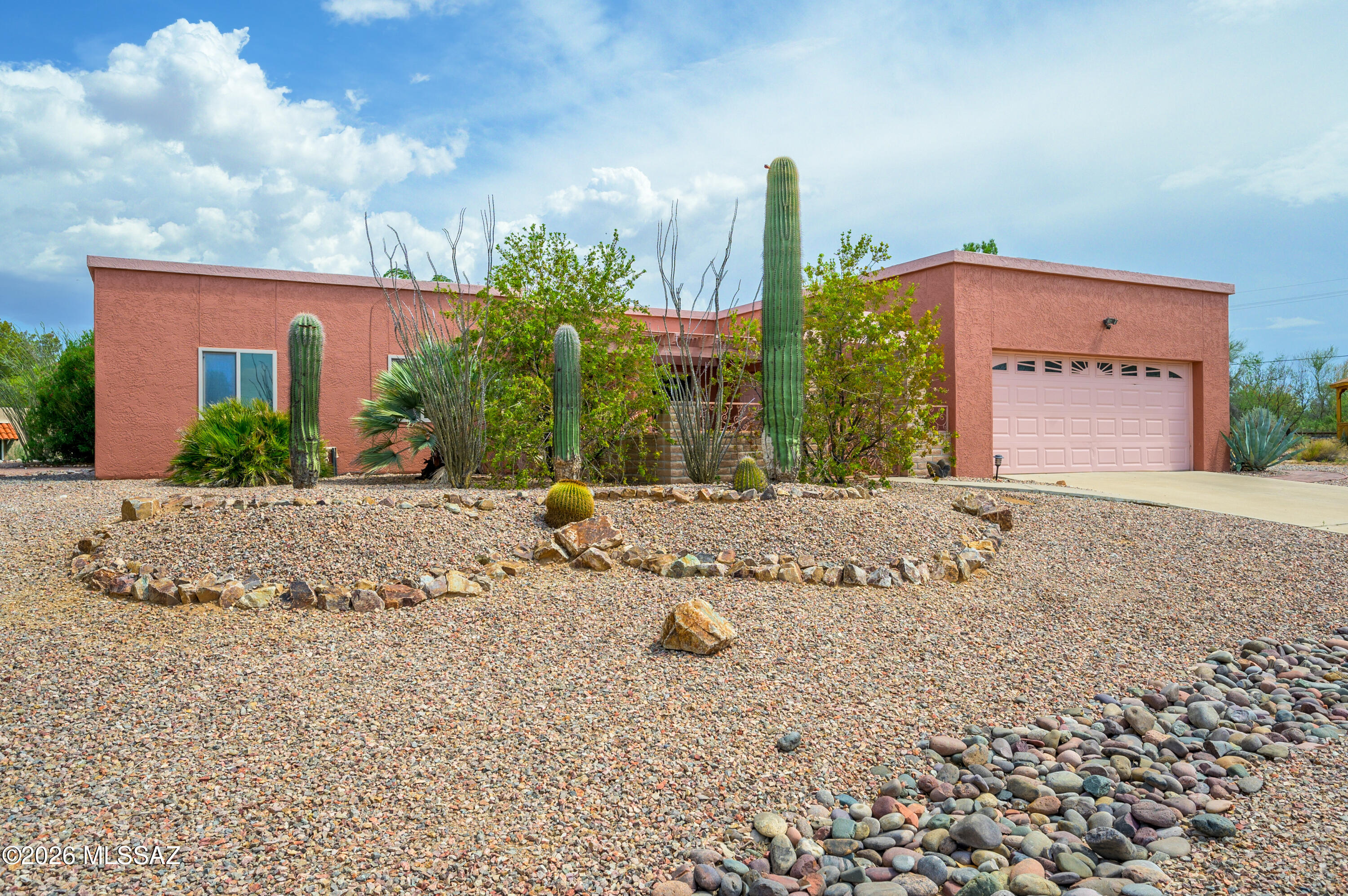 Welcome to Continental Vistas! This charming 3-bedroom, 2-bathroom home is nestled in the heart of Green Valley's highly sought-after 55+ community. Situated on a quiet cul-de-sac with an expansive 0.68-acre lot, this property offers a rare sense of privacy and space. As you arrive, you'll be welcomed by a large, tasteful front patio that creates an inviting first impression and the perfect place to relax and enjoy the Arizona sunshine. Inside, you'll find a beautifully maintained home filled with warmth and character. The freshly painted living room features distinctive decorative tile flooring, while a large picture window fills the space with abundant natural light. The kitchen offers oak cabinetry with soft-close doors, hard-surface countertops, and all appliances are included, making it both functional and move-in ready. The spacious primary suite features an updated ensuite bathroom, creating a comfortable private retreat. Two additional well-appointed bedrooms provide flexibility for guests, a home office, or hobbies--a rare feature in many Green Valley homes. Step outside to enjoy the private backyard, where a covered ramada offers the perfect setting for relaxing or entertaining. A separate workshop provides an ideal space for hobbies, storage, or DIY projects, making this home truly stand out. For added peace of mind, the HVAC system was replaced in 2022, the exterior was painted in 2022, and the roof was recoated in 2024, offering years of dependable comfort and energy efficiency. Located just minutes from the Green Valley Recreation East Center, you'll enjoy convenient access to pools, fitness facilities, classes, and community events. With easy access to I-19, Tucson, and the charming town of Tubac, this home offers the perfect balance of peaceful living, privacy, and connection to everything Southern Arizona has to offer.