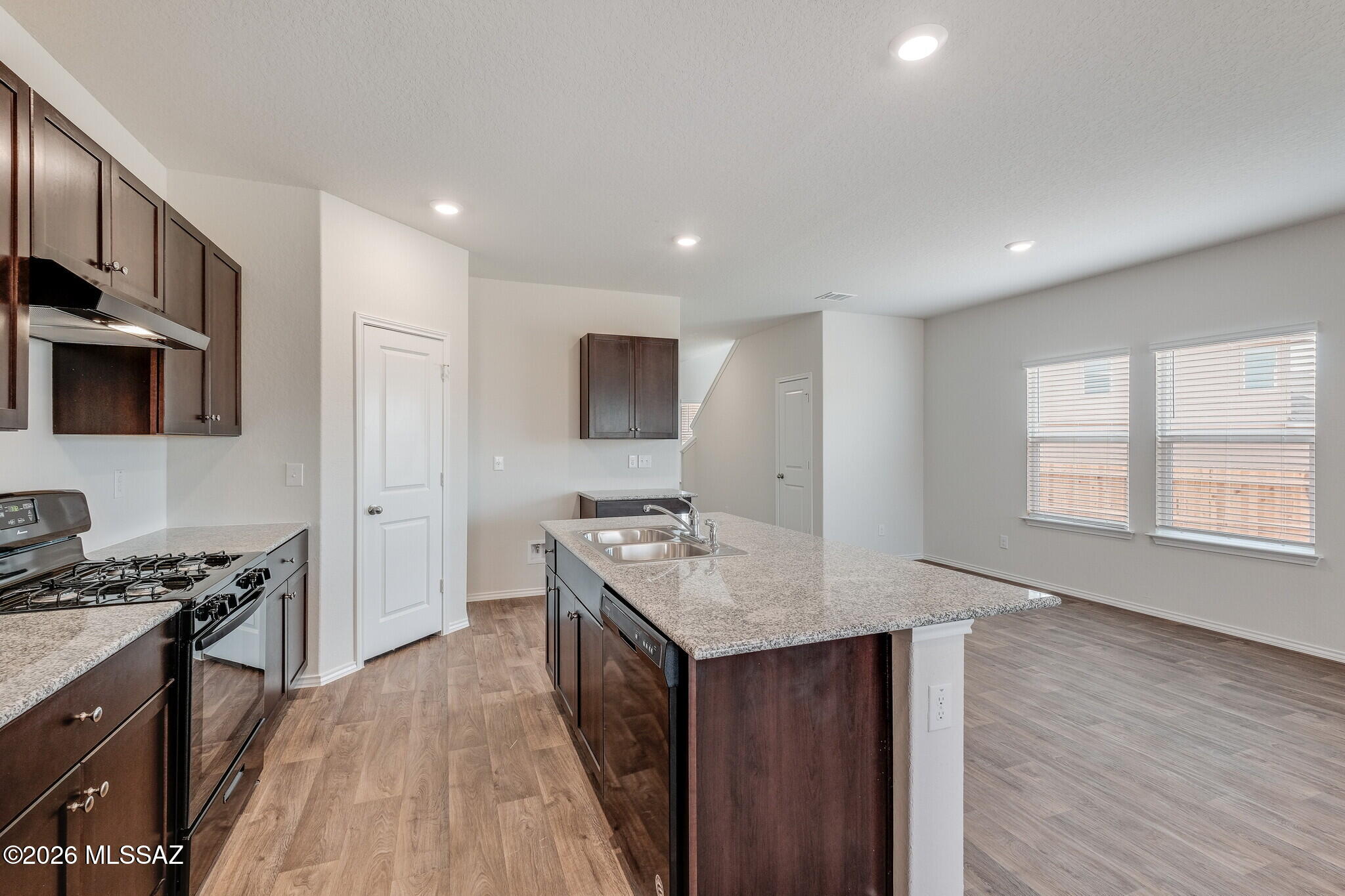 This magnificent 2-story home boasts 2,522sf of thoughtfully designed space, featuring 5 beds, 3 full baths, and a loft. With one bedroom and a full bath conveniently located downstairs, this home offers flexibility and accessibility for multi-generational living or guests. Inside discover a bright and airy open great room plan, accentuated by sleek tile flooring throughout the first floor, except in the bedroom. The kitchen and baths showcase elegant granite countertops and stylish shaker-style cabinets, creating a perfect blend of form and function. Upstairs you will find a generous loft area, ideal for relaxation or entertainment, and a huge primary bedroom retreat, offering a serene oasis to unwind. Find out how to make this stunning residence your new home! SPRAYFOAM insulation!