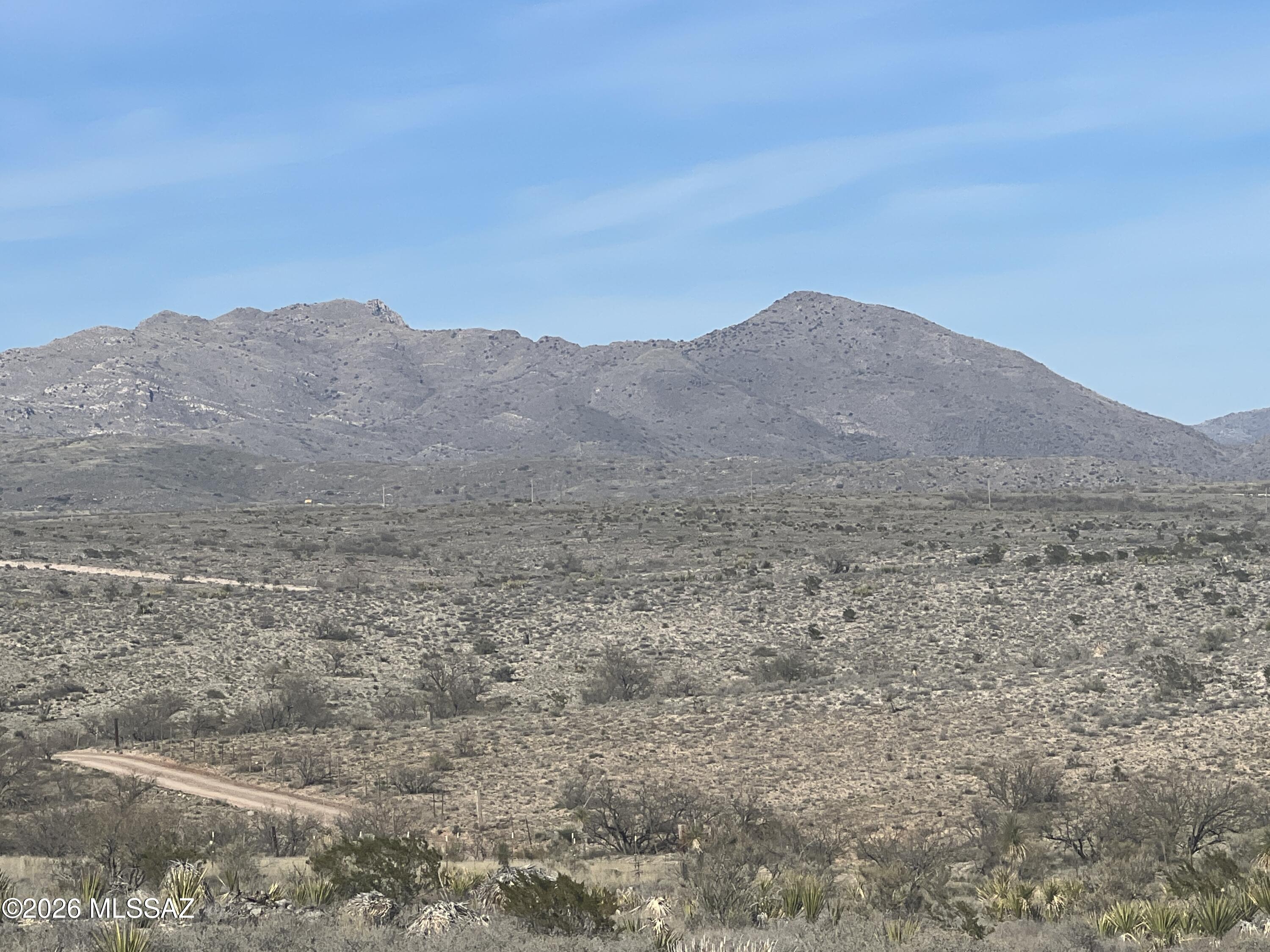 Get away from it all! Away from the hustle and bustle of town! Nice country setting with 360 degree views of the mountains. This 11.25 acre property features a red iron hay barn/equipment storage, storage shed. Manufactured homes and horse, livestock allowed. Abuts Arizona state trust land to the east. Easy commute to Tucson, Vail, Benson